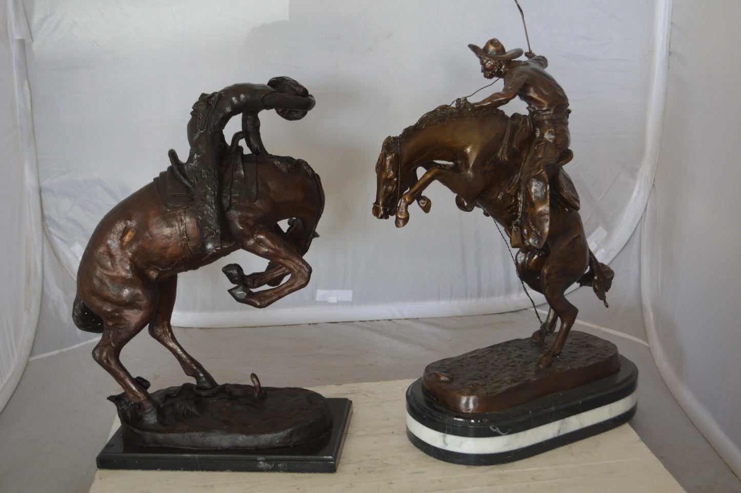 Bronco Buster by Remington Bronze Statue on a triple marble - 21"x 10"x 26"H.