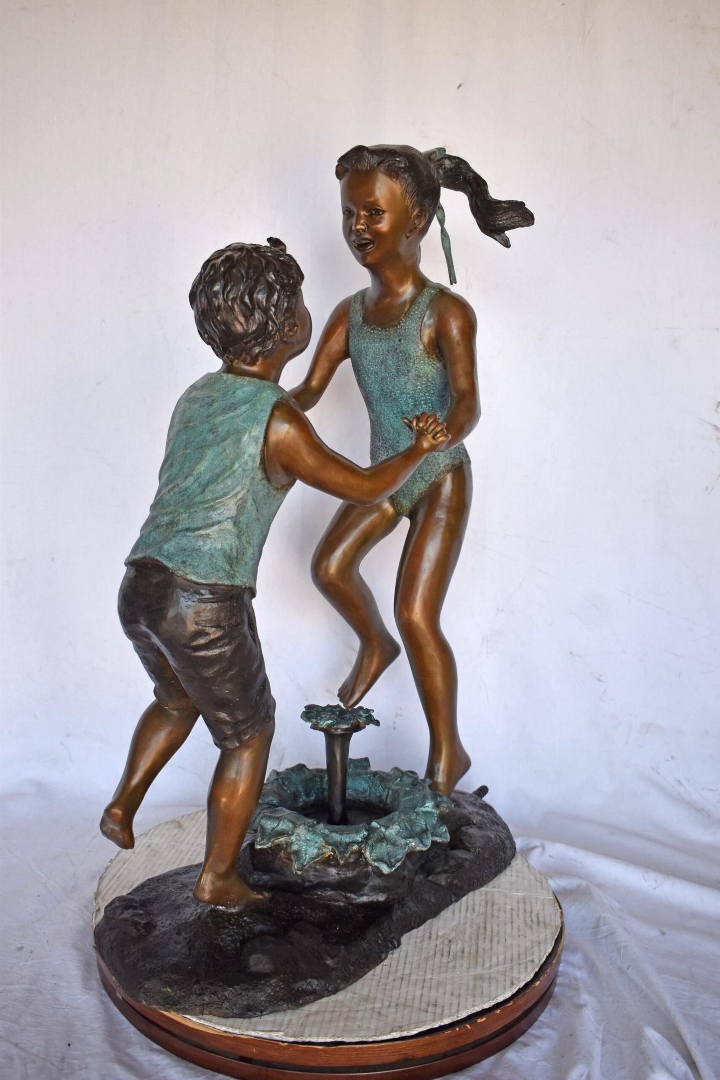 Young Boy and girl dancing around fountain bronze statue-Size 28" x 13" x 38"H