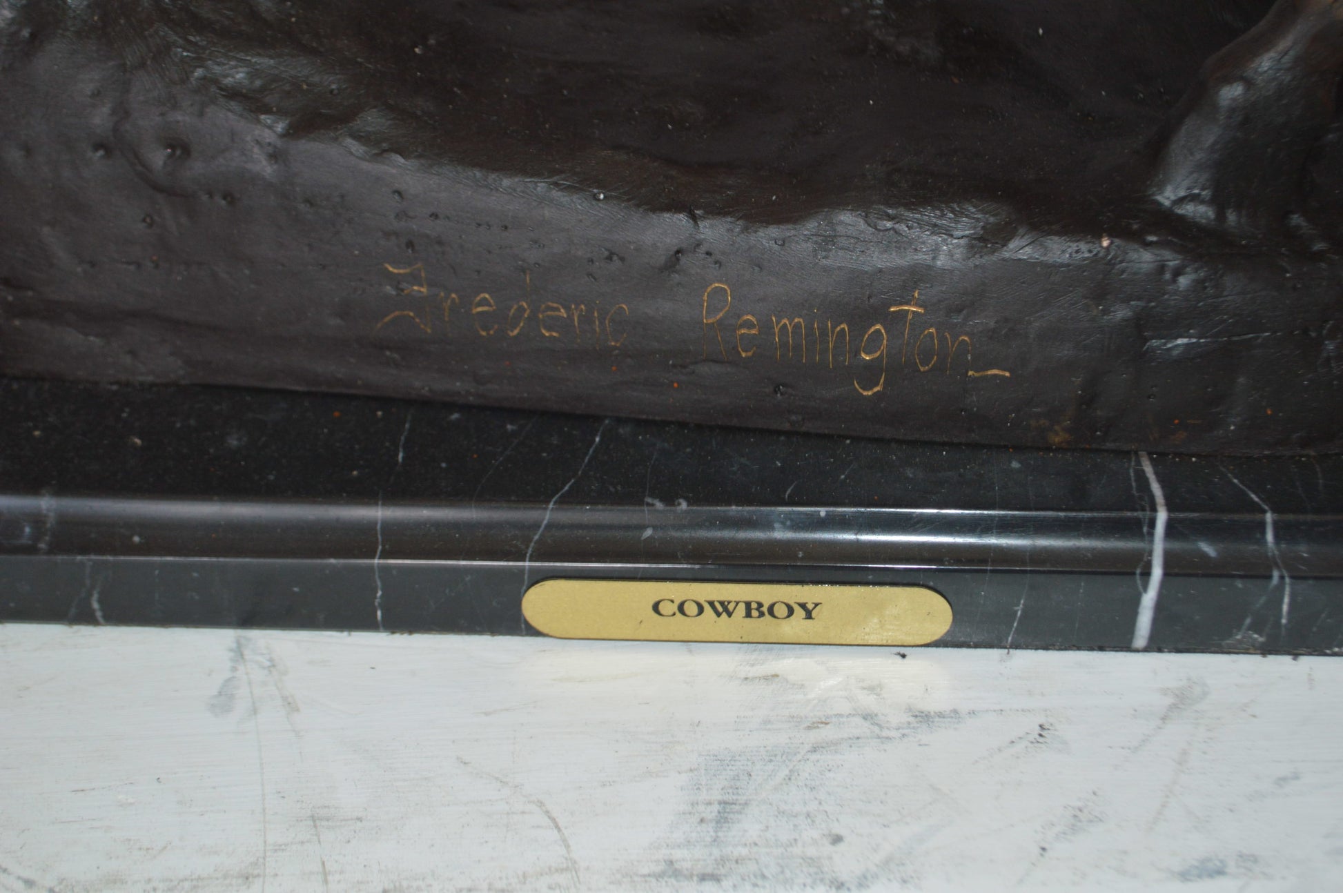 Remington Cowboy on marble Bronze Statue -  Size: 24"L x 9"W x 23"H.