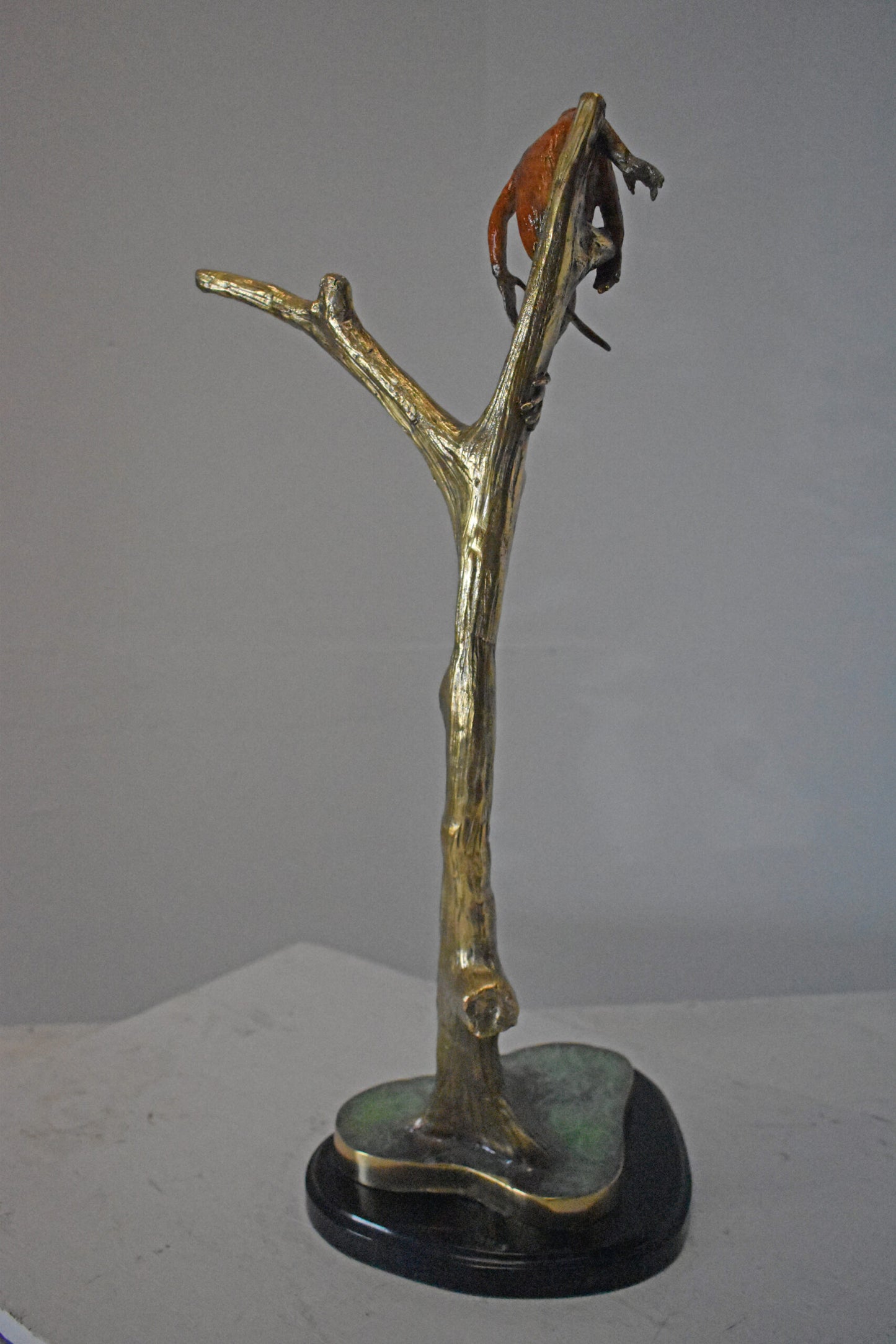 Colored Monkey Resting on a Tree Bronze Statue - Size: 12"L x 13"W x 27"H.