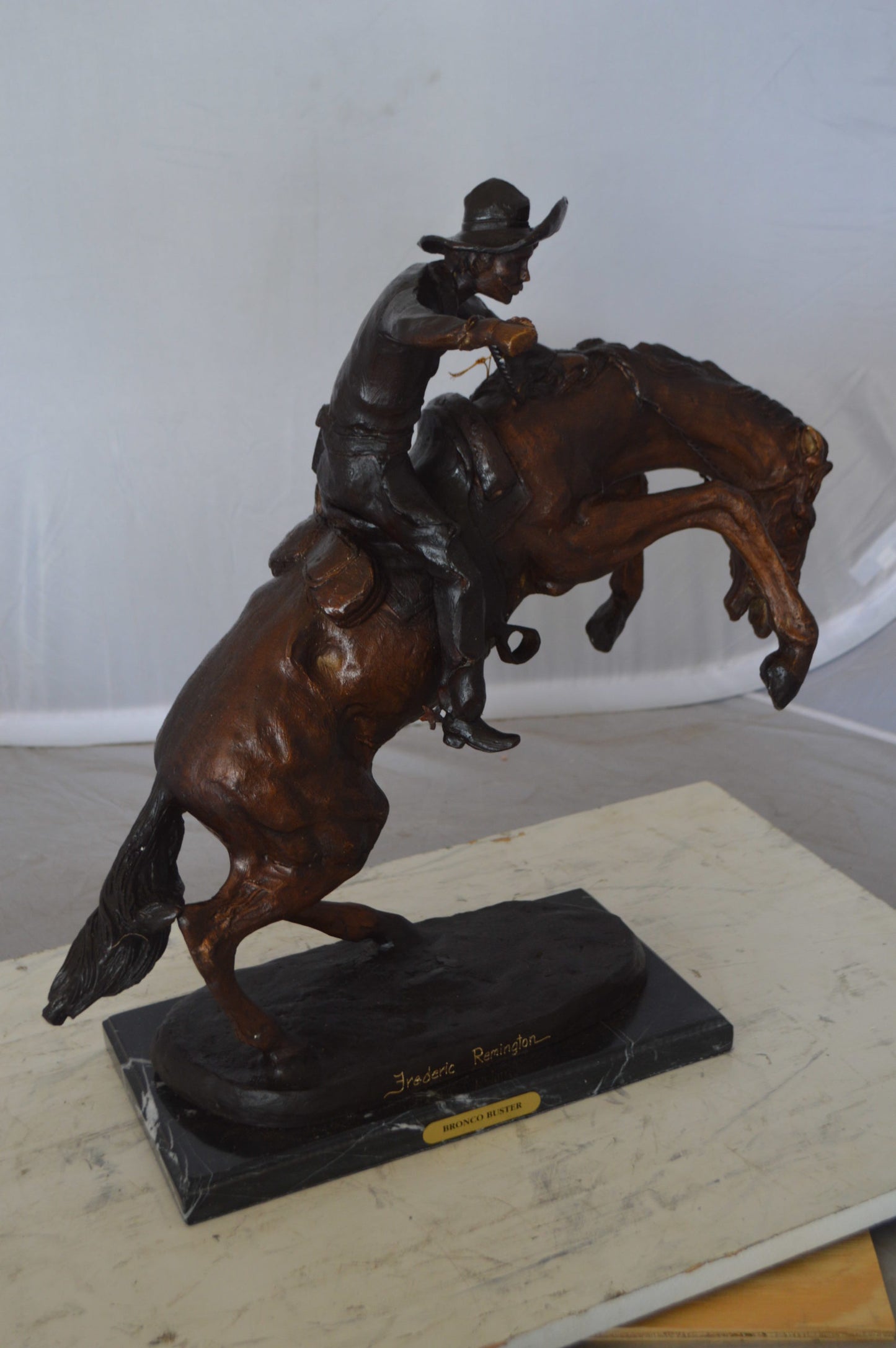 Bronco Buster Bronze Statue by Remington - Size: 9"L x 24"W x 21"H.