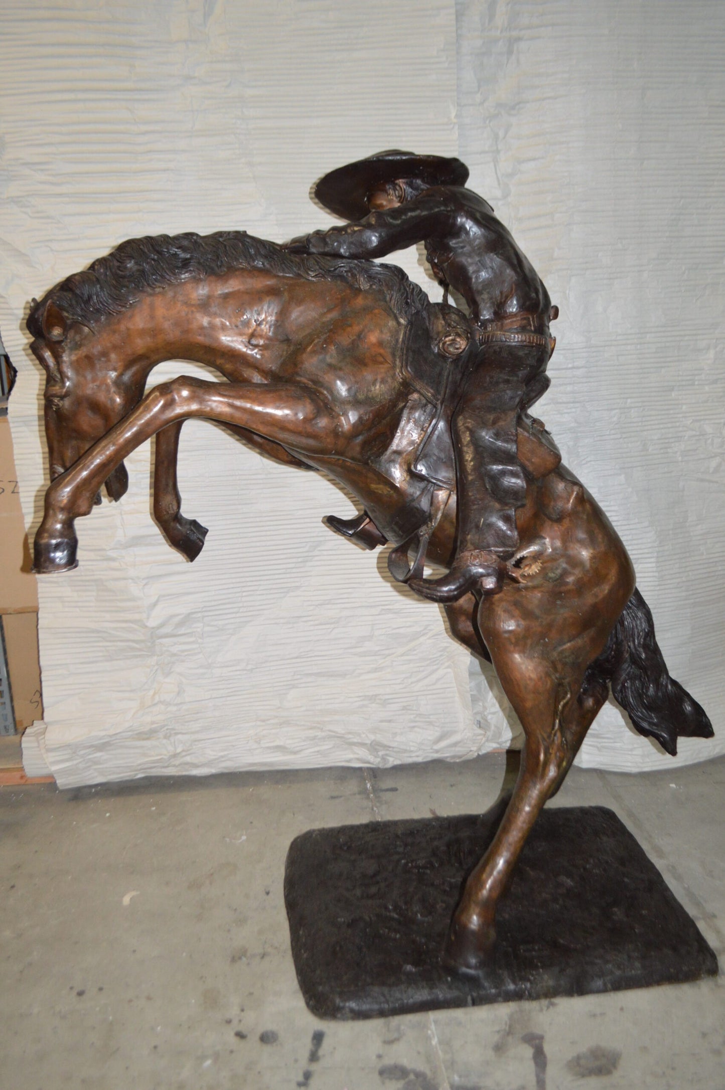Bronco Buster Giant Bronze Statue - Size: 65"L x 52"W x 64"H.