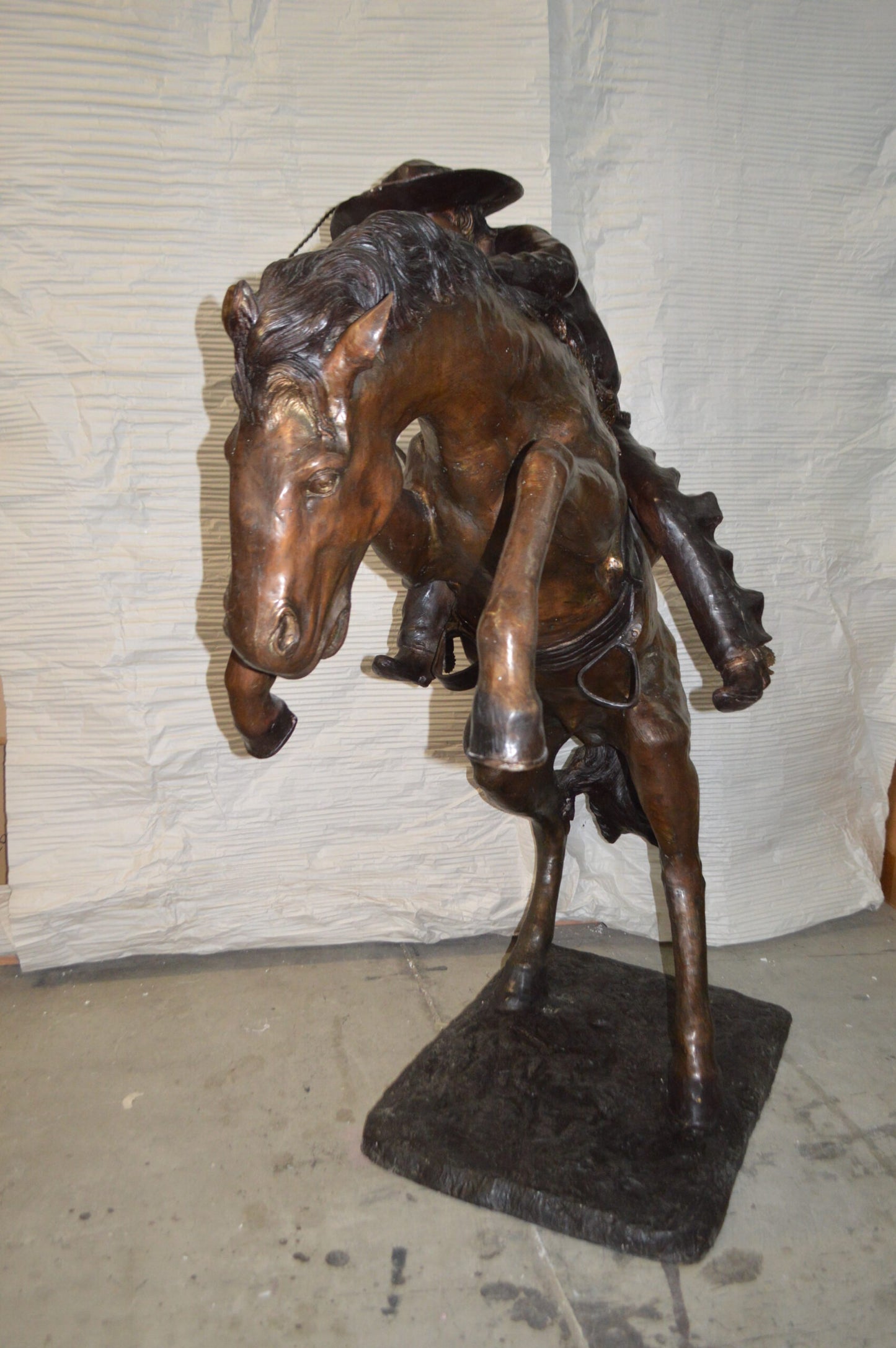 Bronco Buster Giant Bronze Statue - Size: 65"L x 52"W x 64"H.
