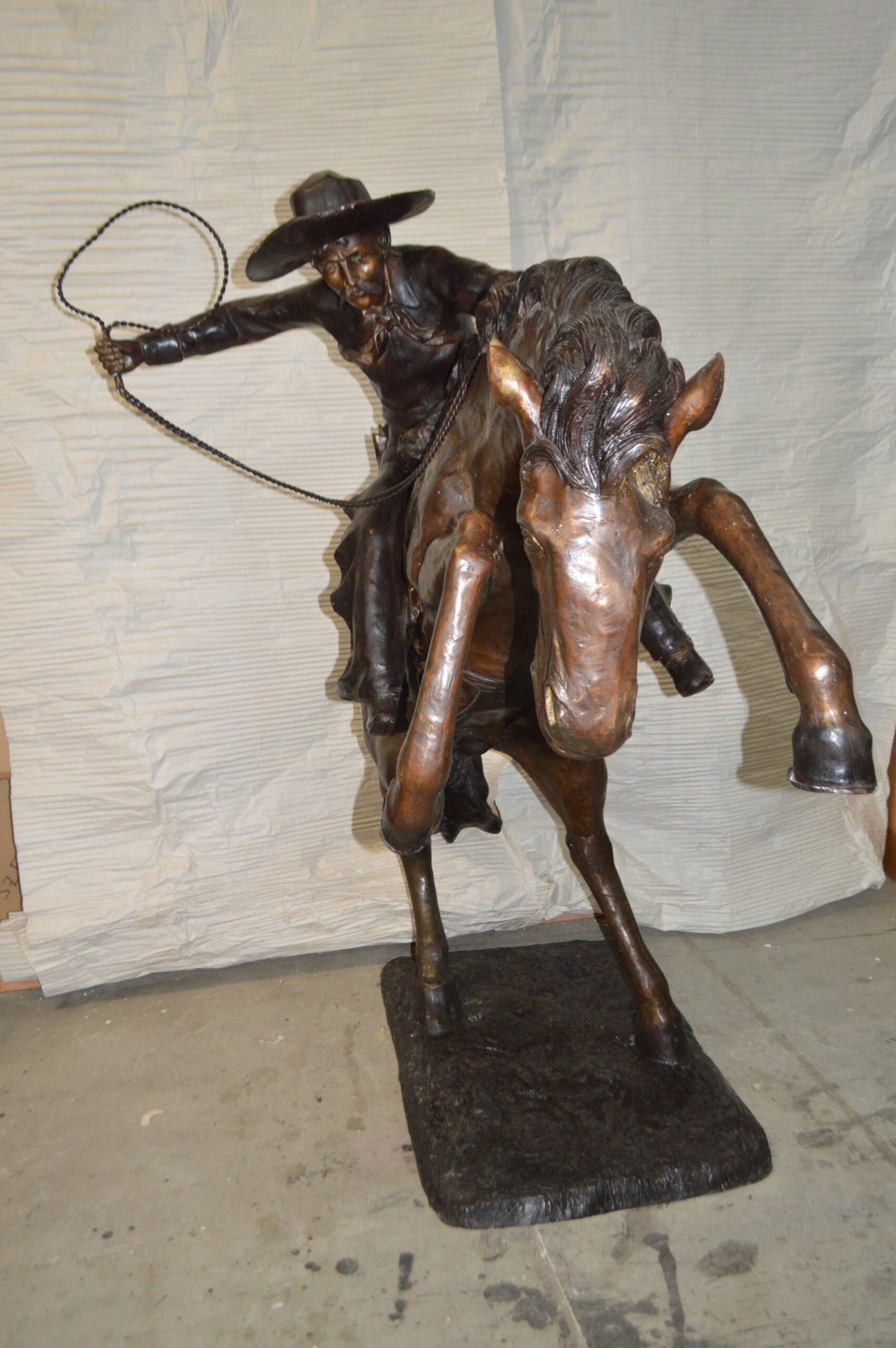 Bronco Buster Giant Bronze Statue - Size: 65"L x 52"W x 64"H.