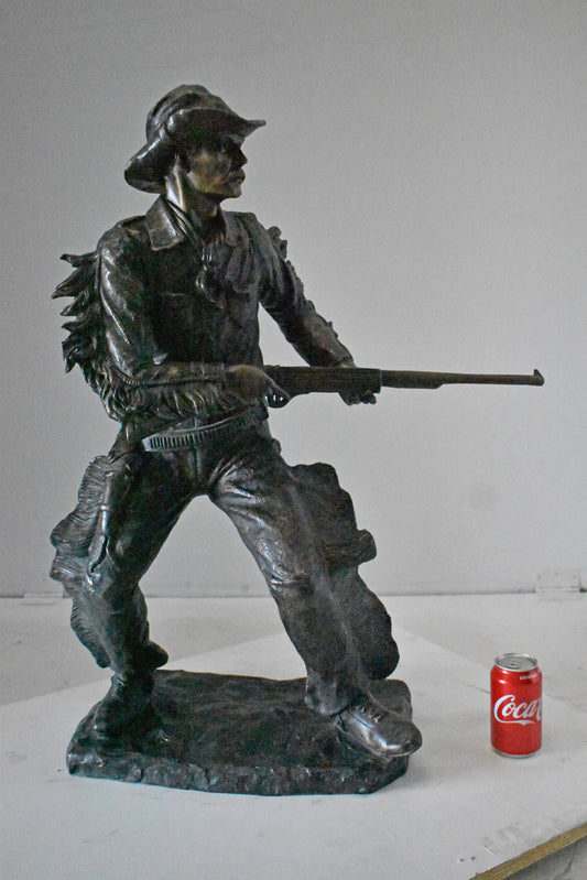 Cowboy with His Gun Bronze Statue - Size: 26"L x 13"W x 33"H.