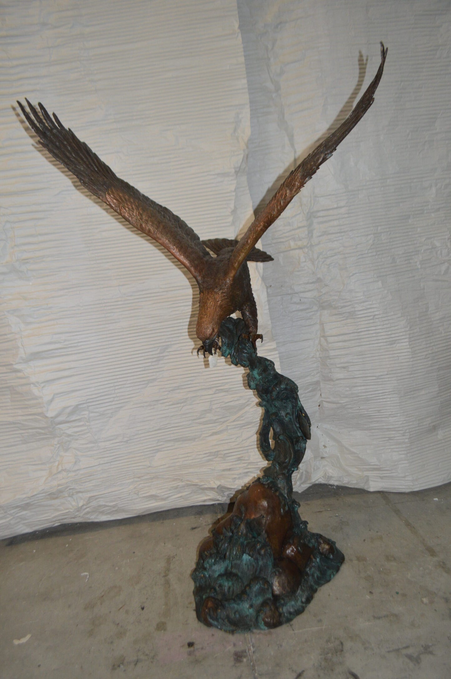 Flying Eagle on Wave Bronze Statue - Size: 25"L x 35"W x 57"H.