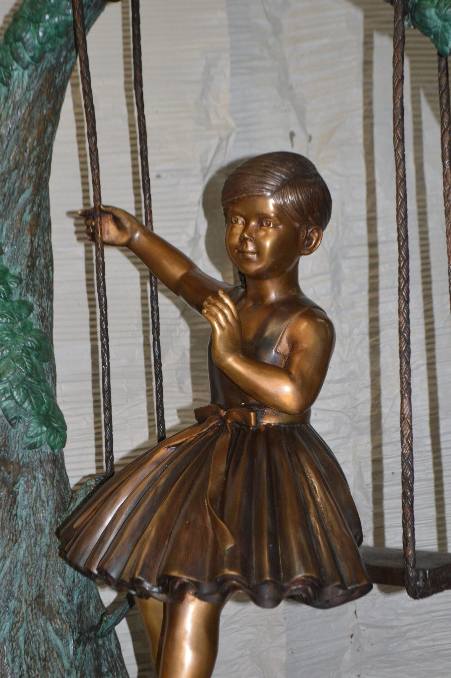 Girl on Swing 65 Bronze Statue - Size: 44"L x 35"W x 65"H.