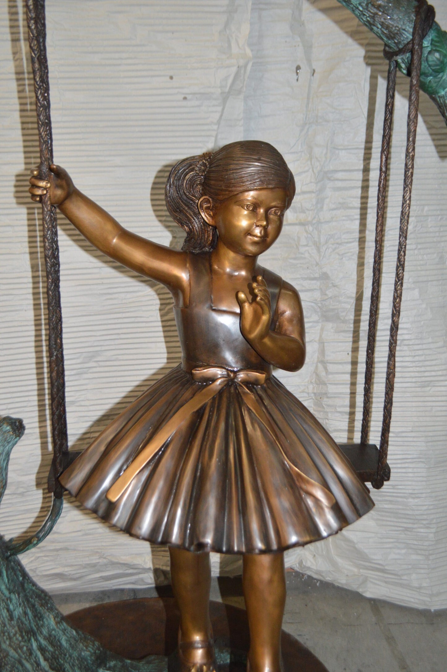 Girl on Swing 65 Bronze Statue - Size: 44"L x 35"W x 65"H.