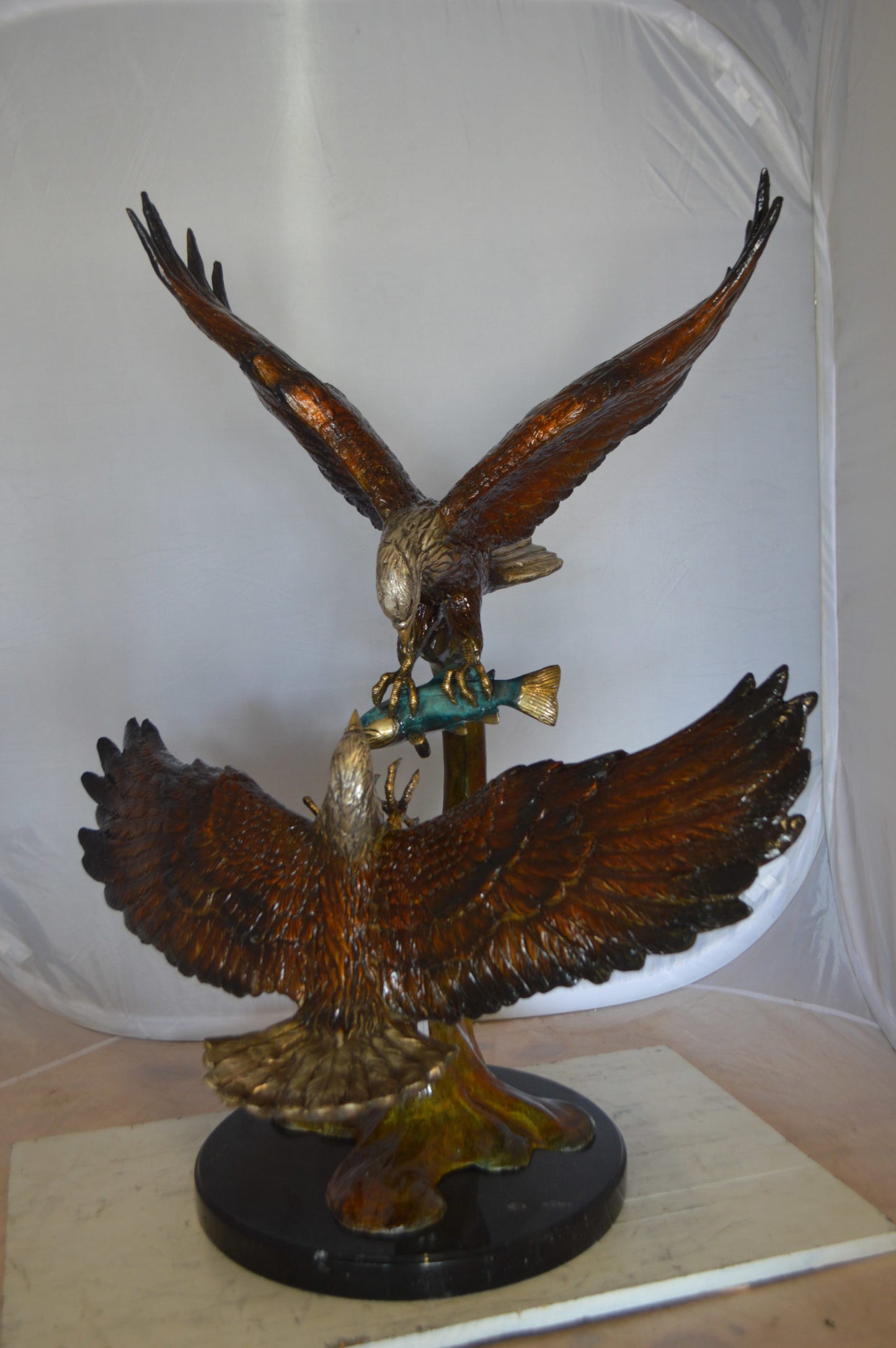 Two Eagles Fighting on Fish Bronze Statue - Size: 33"L x 28"W x 42"H.