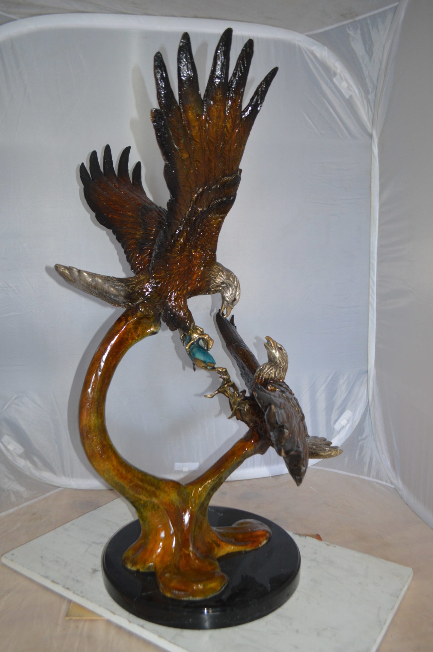 Two Eagles Fighting on Fish Bronze Statue - Size: 33"L x 28"W x 42"H.