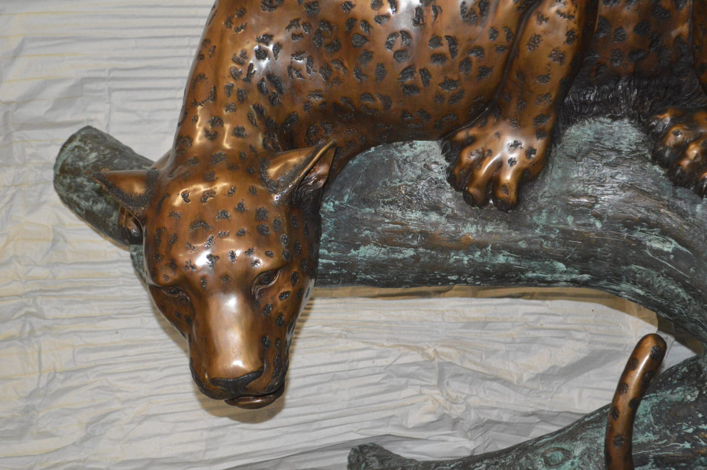 Leopard on a Tree Trunk Bronze Statue - Size: 38"L x 34"W x 36"H.