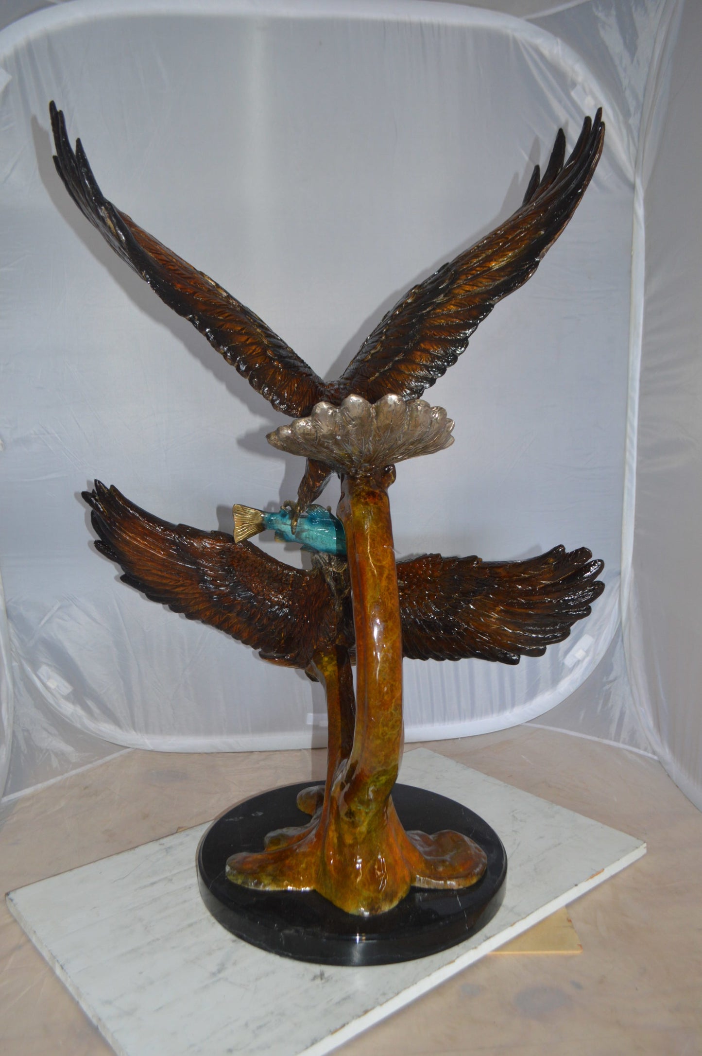 Two Eagles Fighting on Fish Bronze Statue - Size: 33"L x 28"W x 42"H.