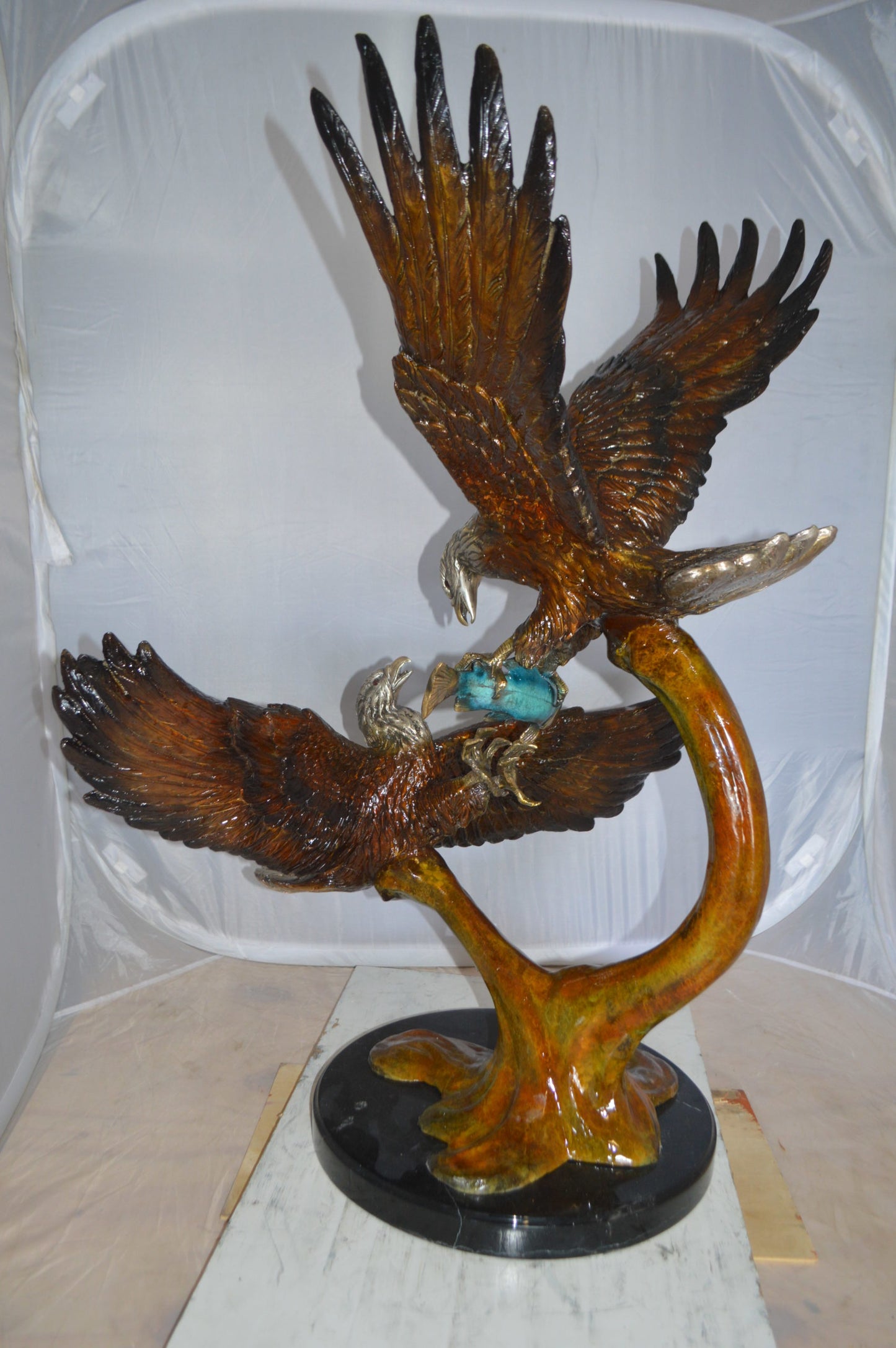 Two Eagles Fighting on Fish Bronze Statue - Size: 33"L x 28"W x 42"H.