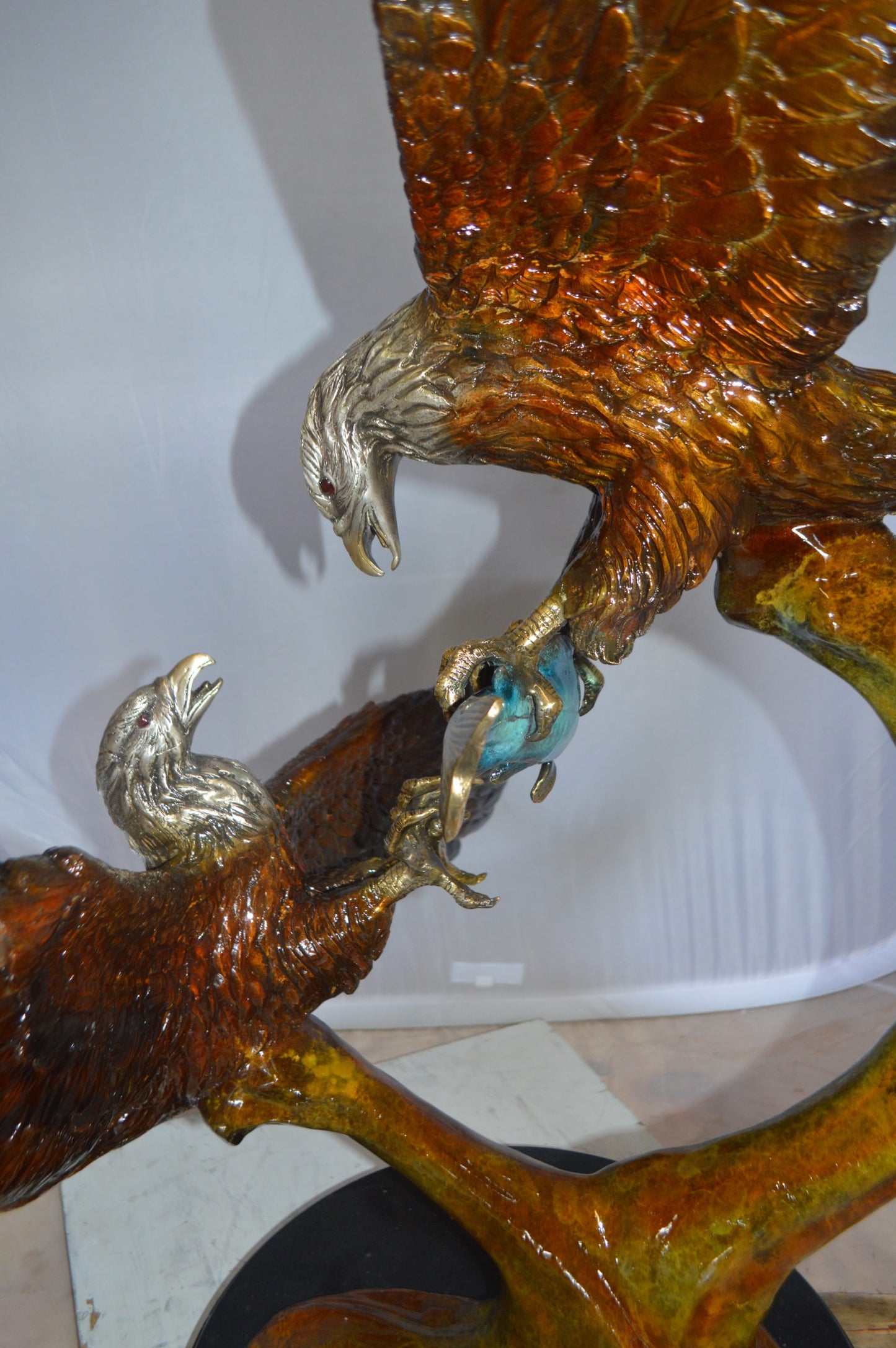 Two Eagles Fighting on Fish Bronze Statue - Size: 33"L x 28"W x 42"H.