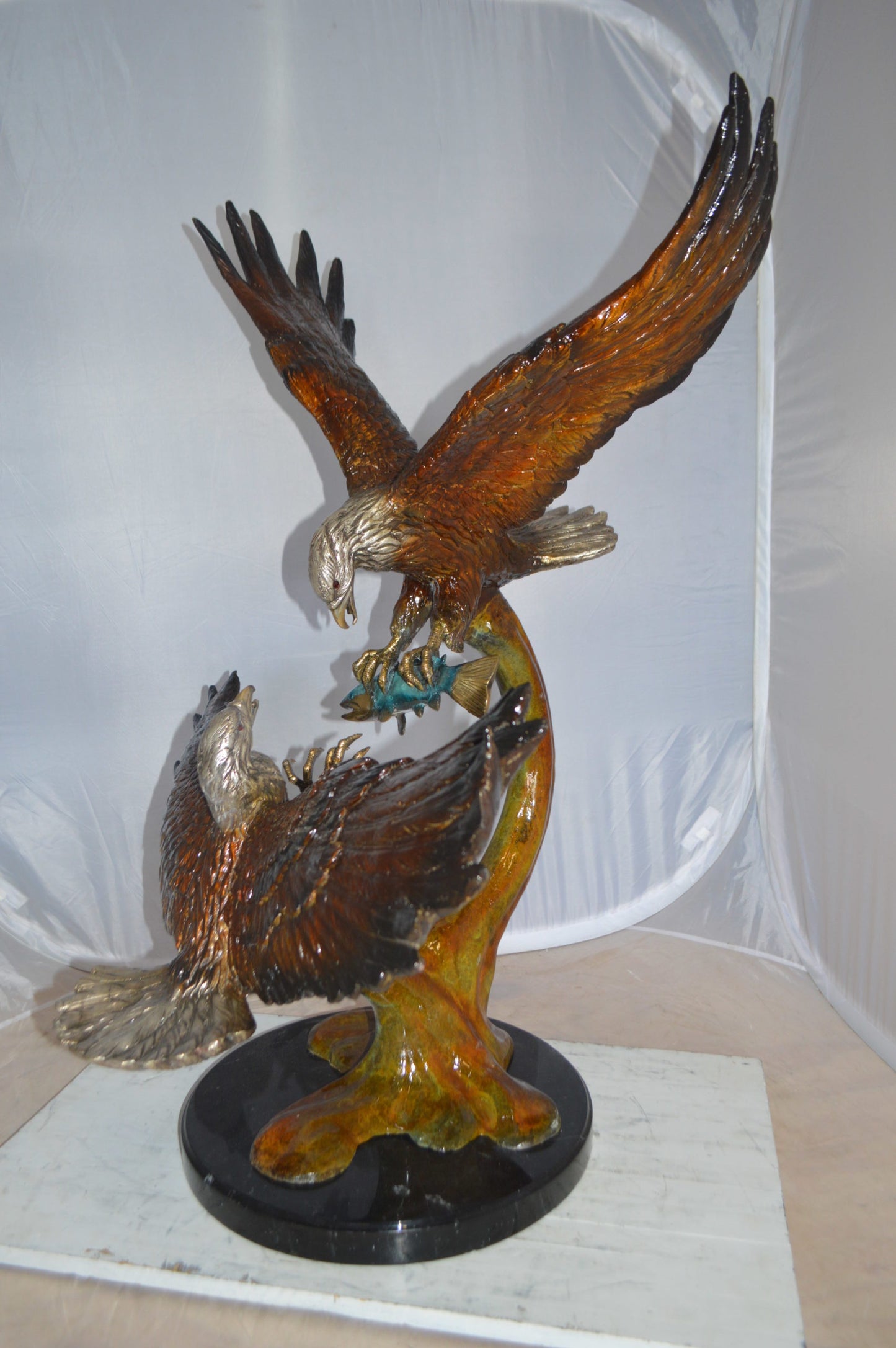 Two Eagles Fighting on Fish Bronze Statue - Size: 33"L x 28"W x 42"H.