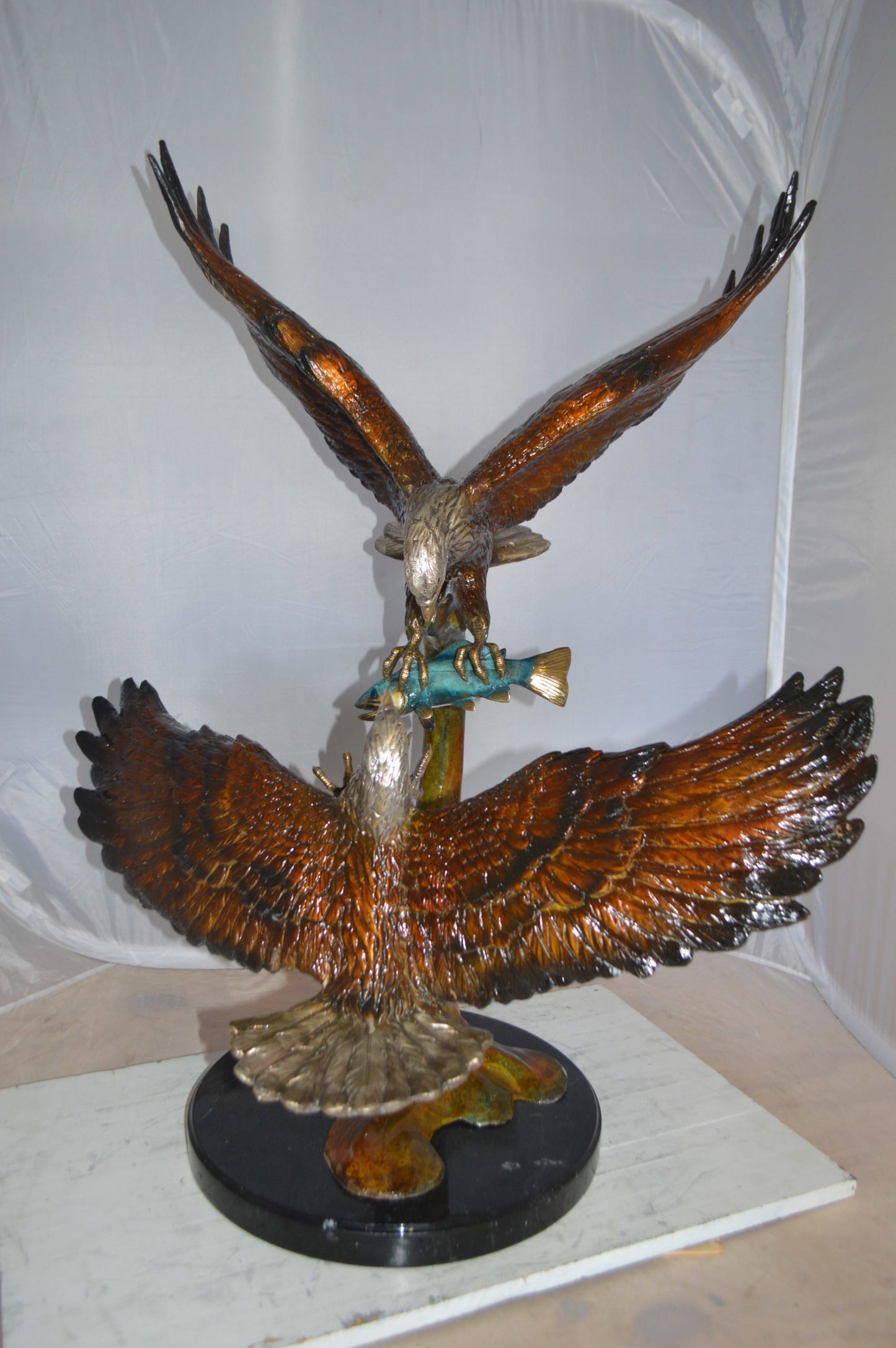 Two Eagles Fighting on Fish Bronze Statue - Size: 33"L x 28"W x 42"H.