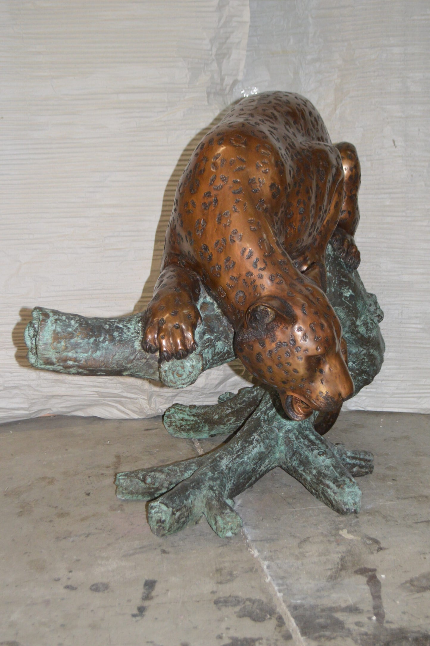 Leopard on a Tree Trunk Bronze Statue -  Size: 38"L x 34"W x 36"H.