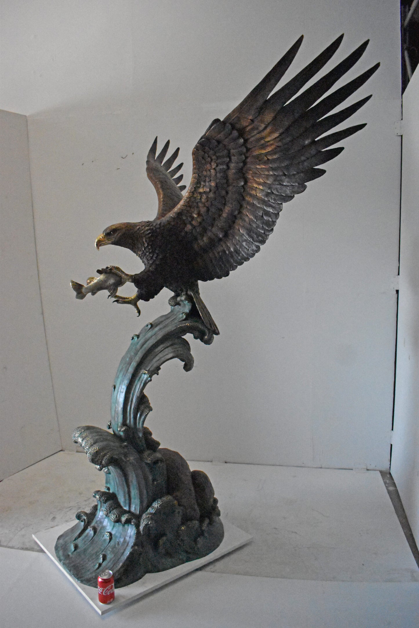 Eagle in Action Catching His Prey Bronze Statue - Size: 68"L x 40"W x 87"H.