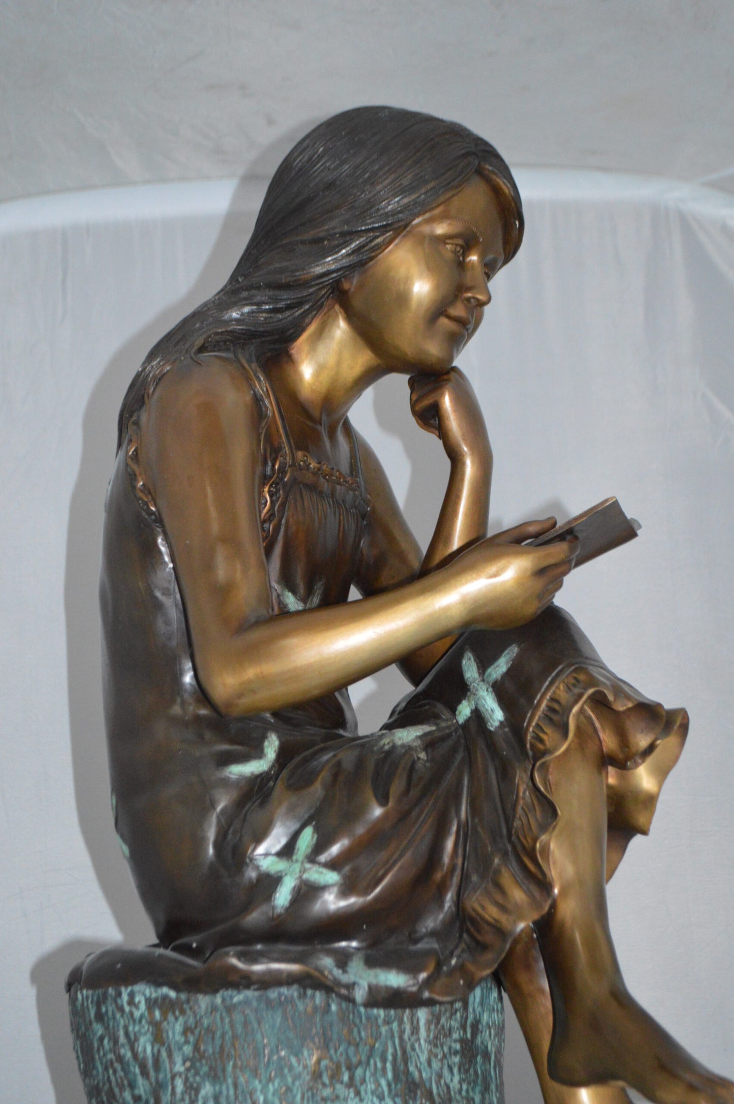Sitting Girl on Log Reading a Book Bronze Statue - Size: 19"L x 13"W x 48"H.