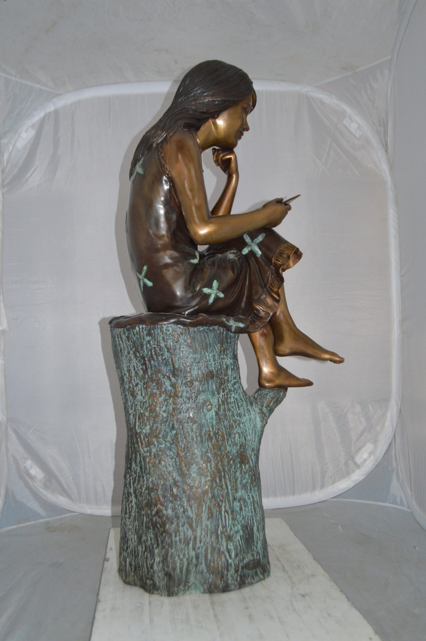 Sitting Girl on Log Reading a Book Bronze Statue - Size: 19"L x 13"W x 48"H.