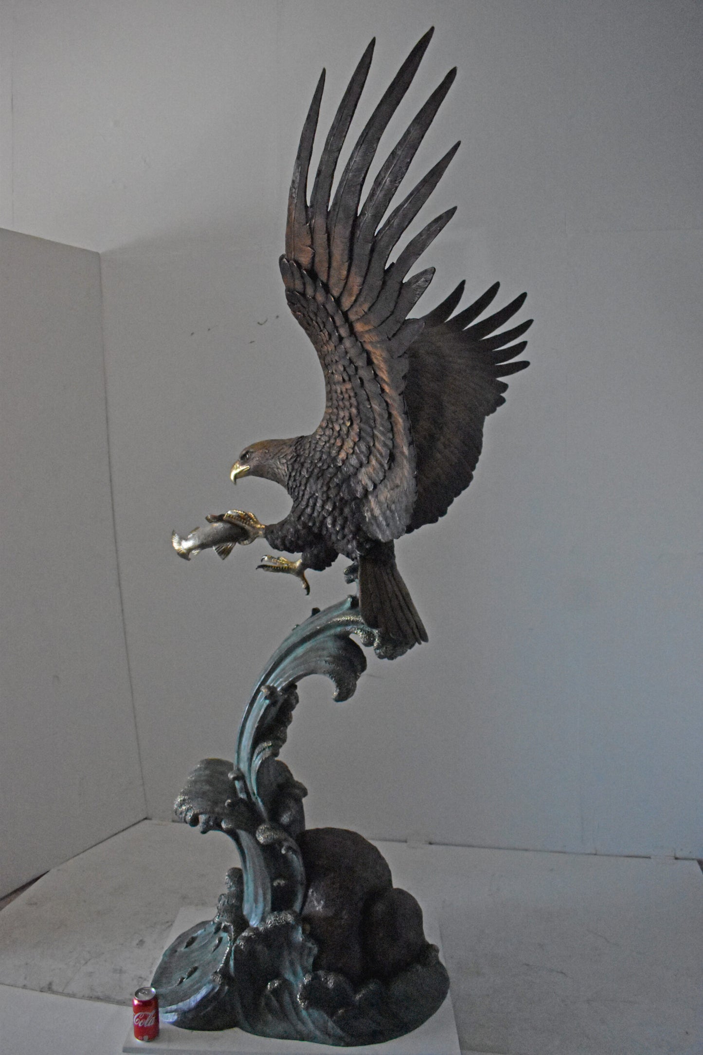 Eagle in Action Catching His Prey Bronze Statue - Size: 68"L x 40"W x 87"H.
