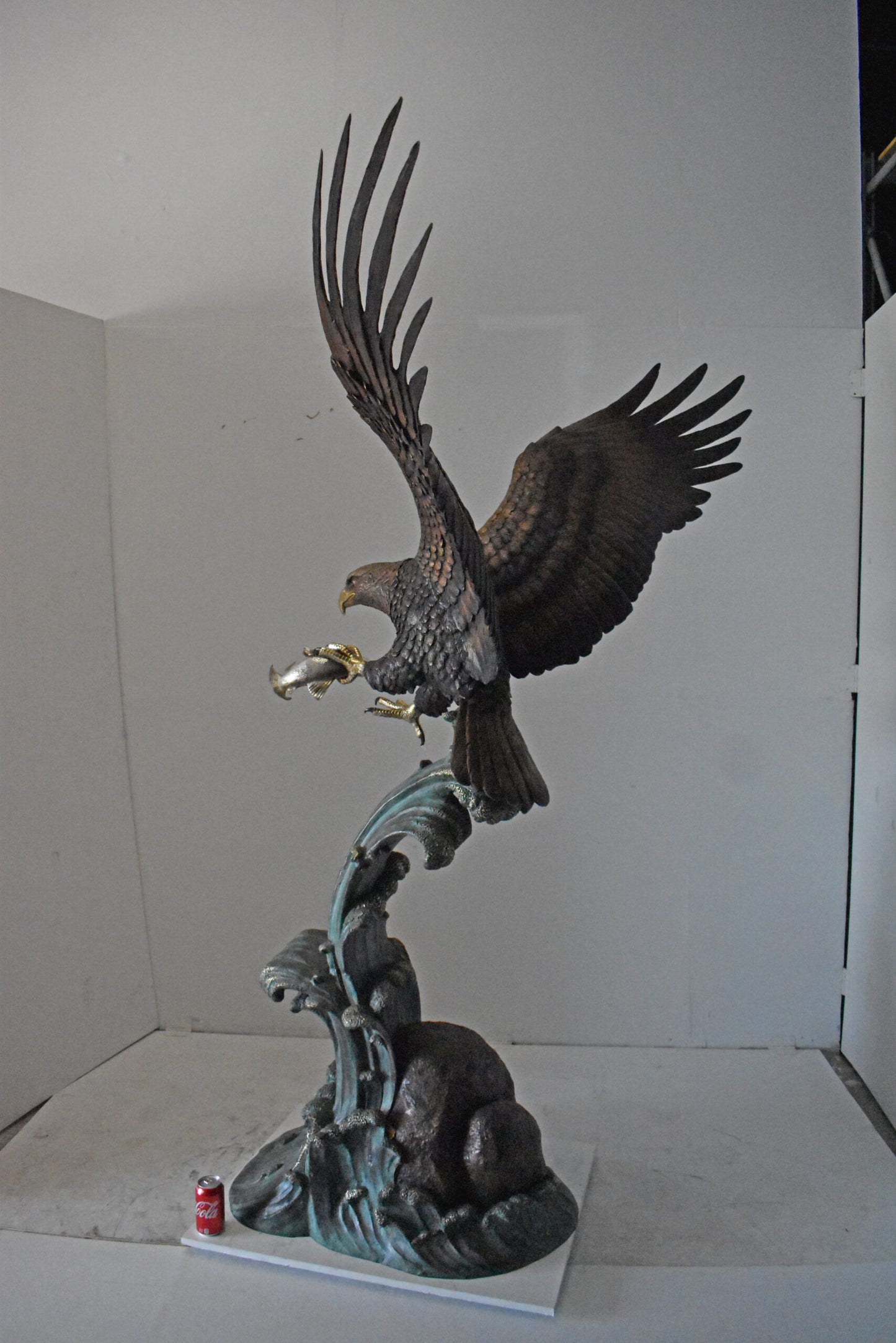 Eagle in Action Catching His Prey Bronze Statue - Size: 68"L x 40"W x 87"H.