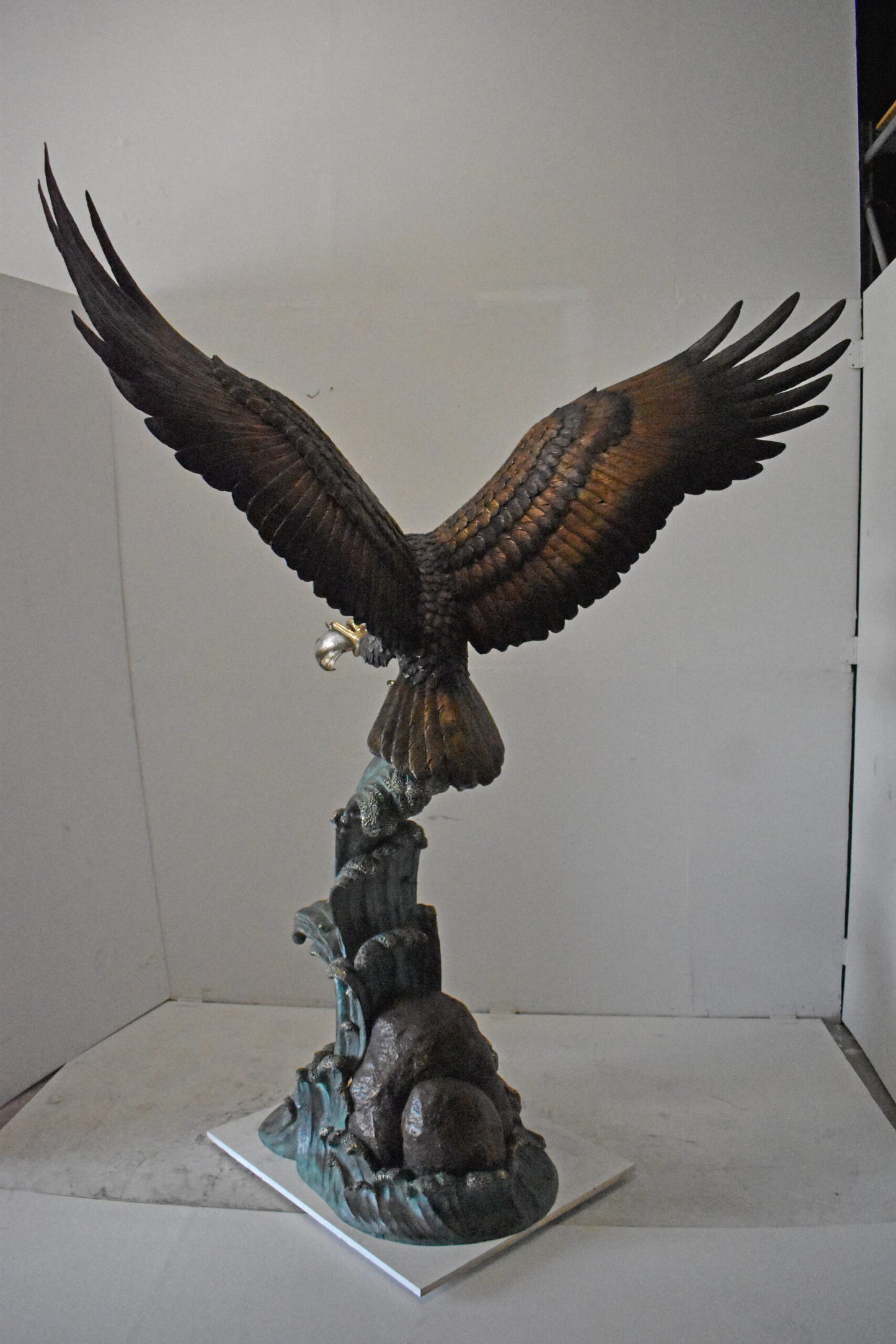 Eagle in Action Catching His Prey Bronze Statue - Size: 68"L x 40"W x 87"H.