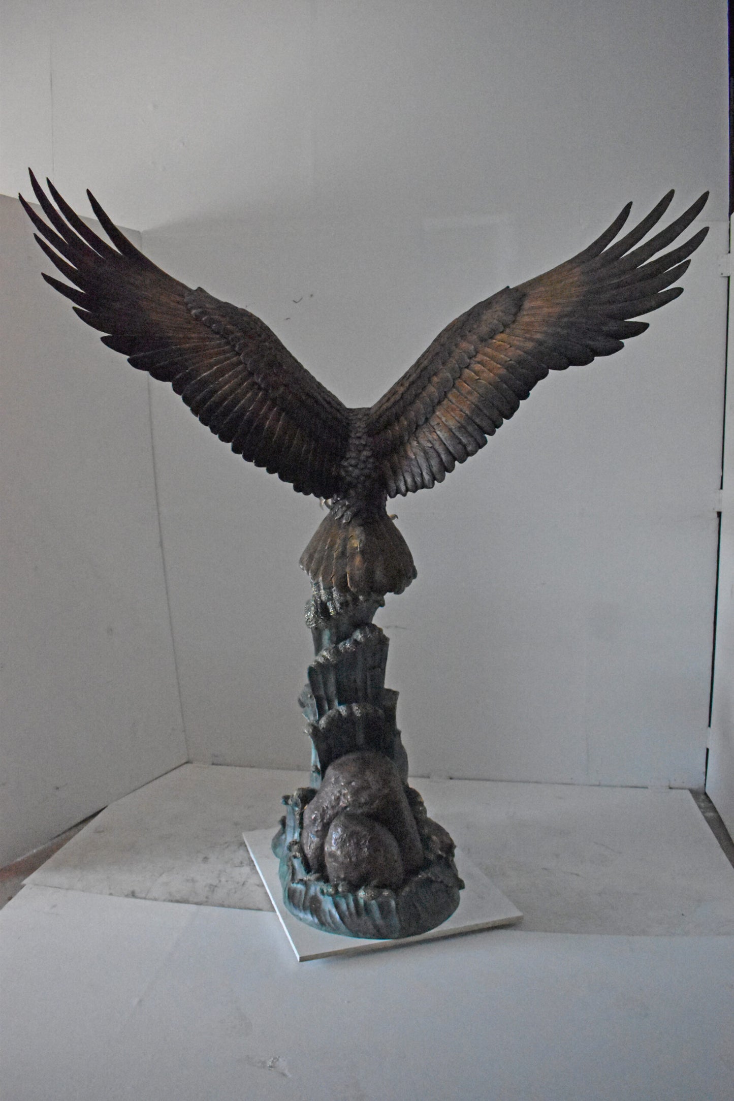Eagle in Action Catching His Prey Bronze Statue - Size: 68"L x 40"W x 87"H.