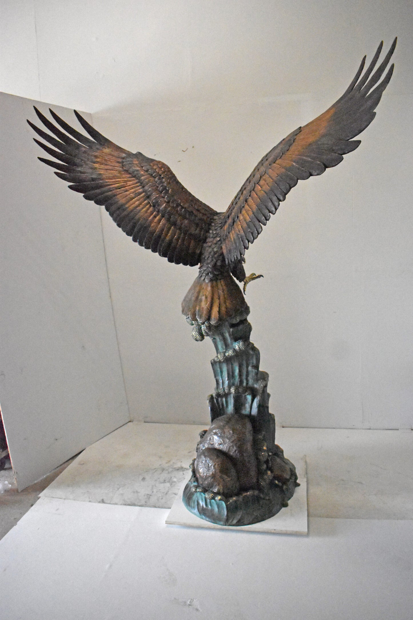Eagle in Action Catching His Prey Bronze Statue - Size: 68"L x 40"W x 87"H.