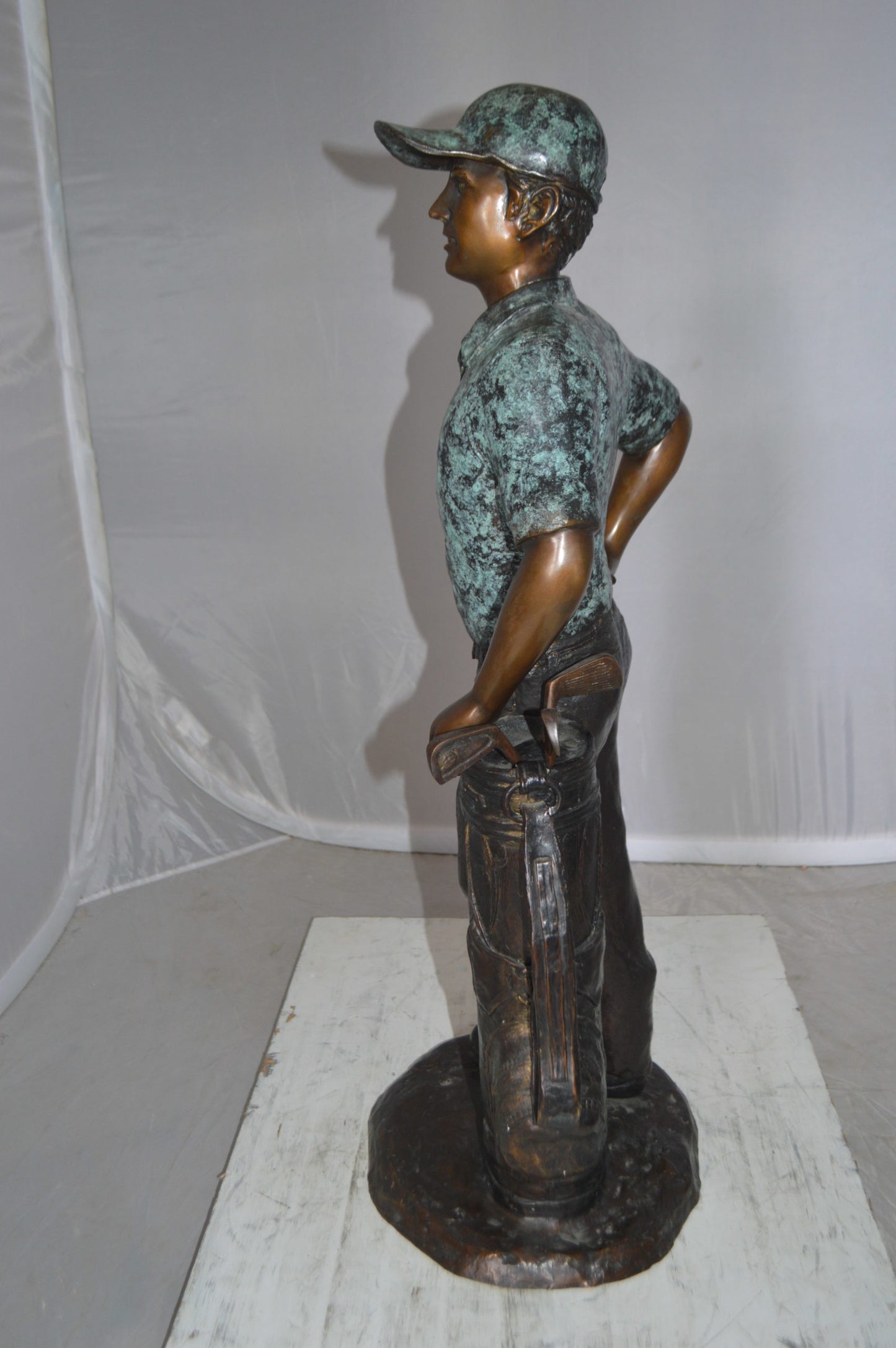 Golfer with bag Bronze Statue - Size: 12"L x 13"W x 32"H.