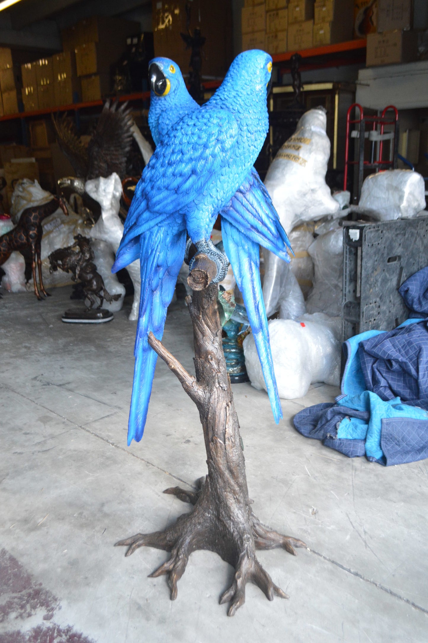 Pair of Blue Parrots on a tree - Bronze Statue - Size: 43"L x 28"W x 67"H.