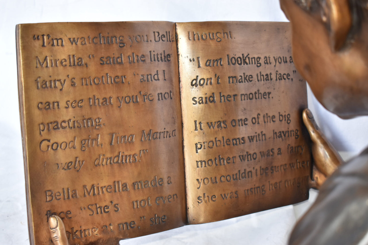 African American Boy reading a book bronze statue - Size: 42"L x 15"W x 19"H.