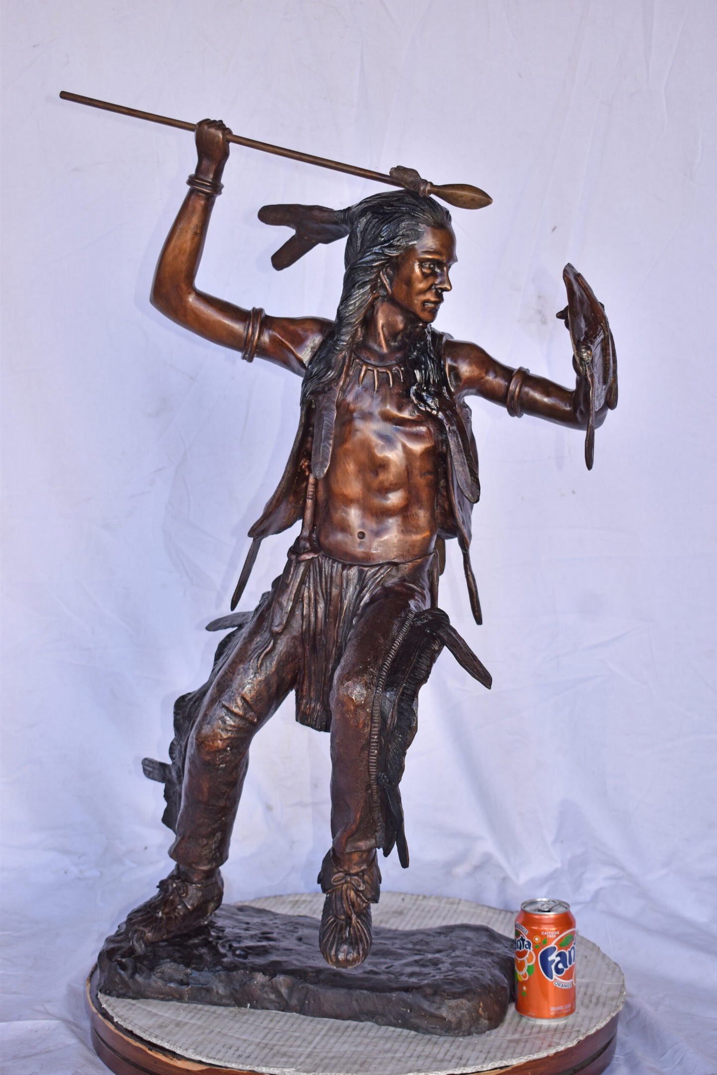 Indian Worrier Throwing a Spear Bronze Statue - Size: 15"L x 23"W x 38"H.