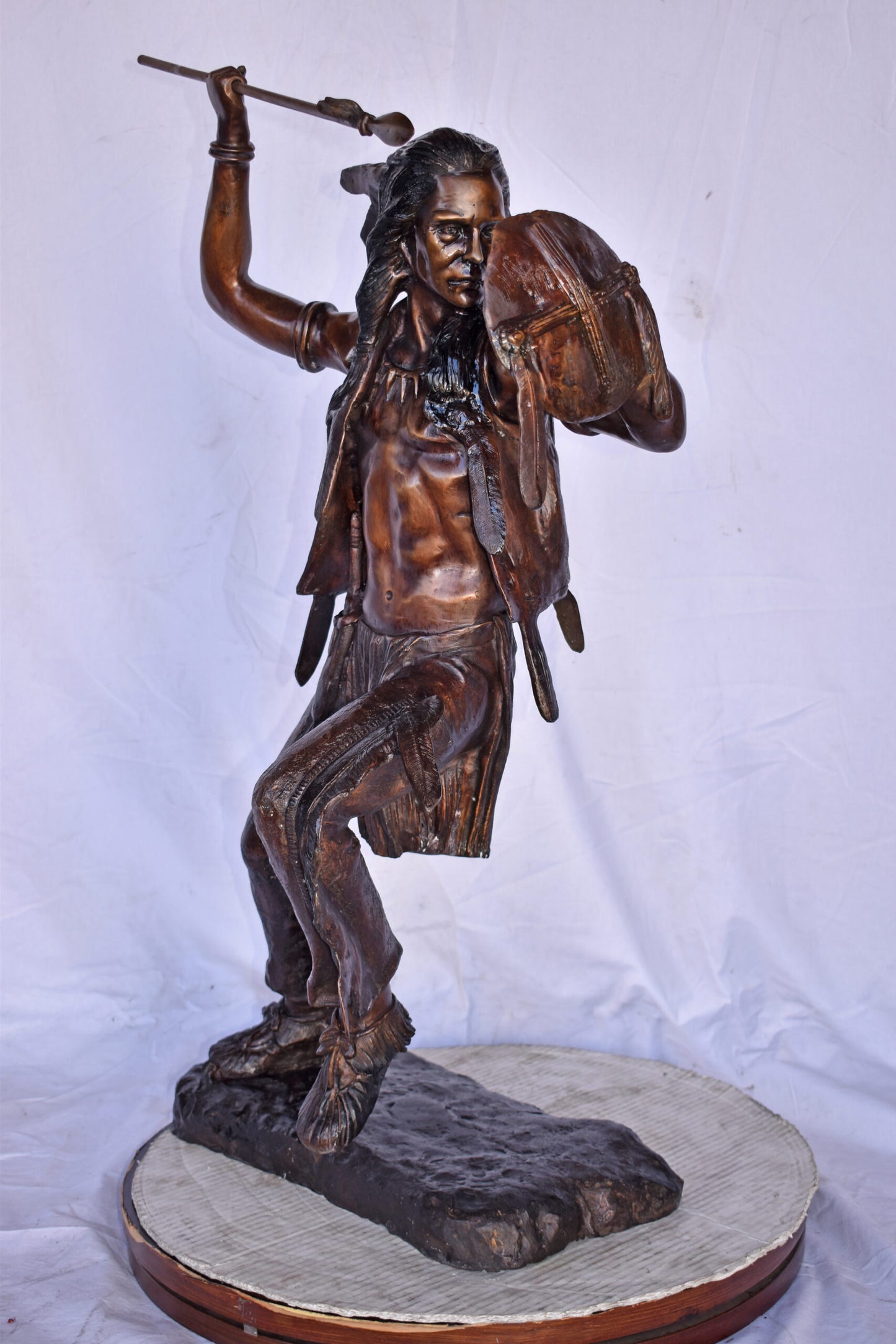 Indian Worrier Throwing a Spear Bronze Statue - Size: 15"L x 23"W x 38"H.