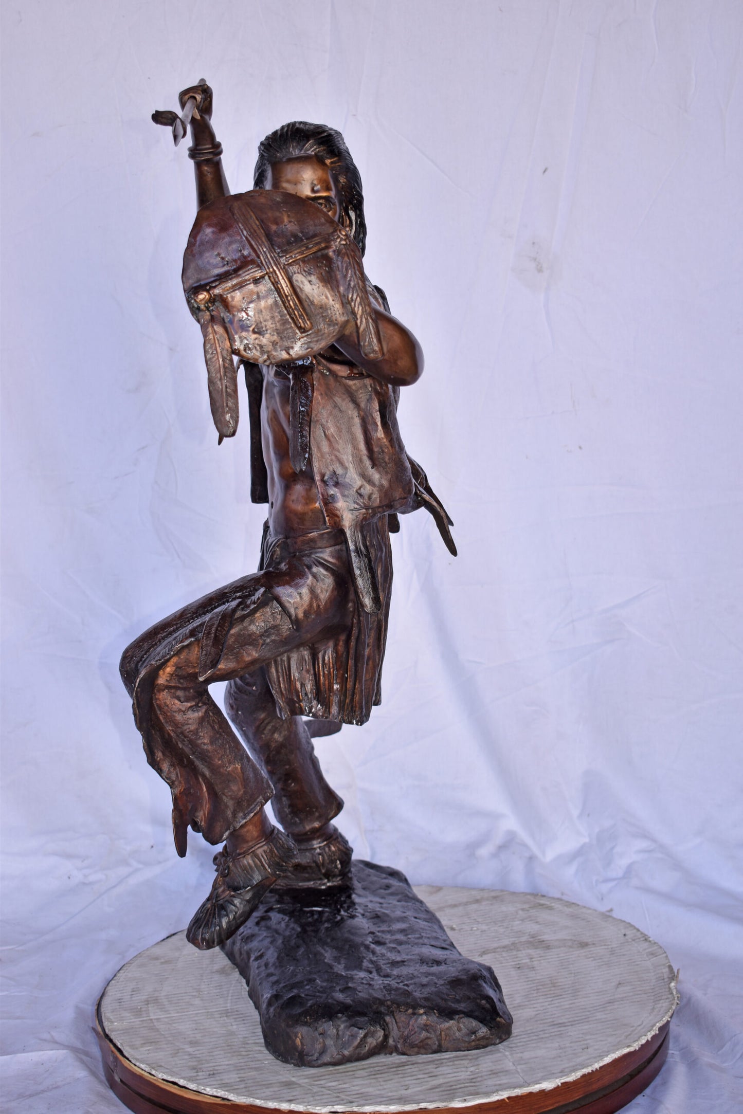 Indian Worrier Throwing a Spear Bronze Statue - Size: 15"L x 23"W x 38"H.
