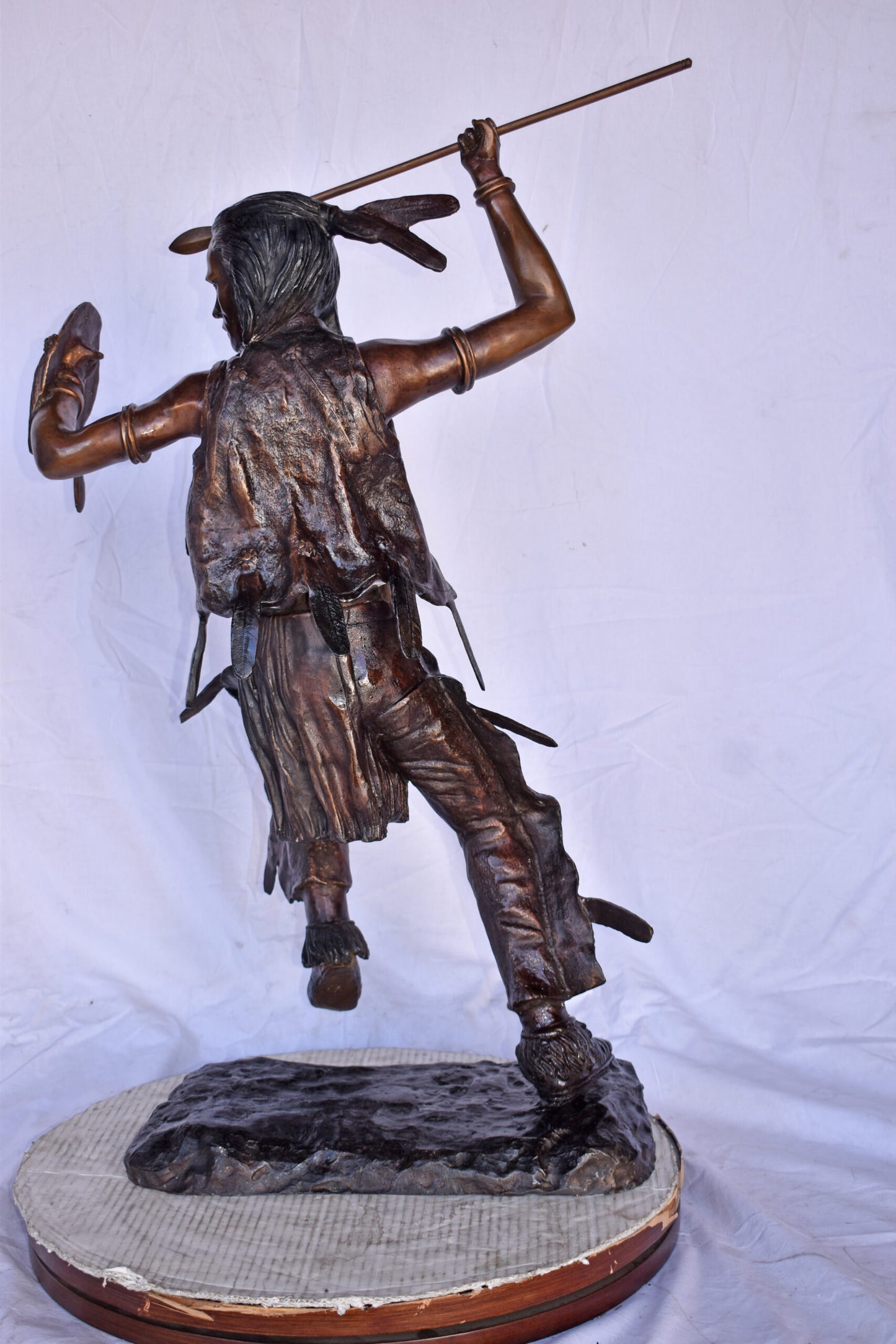 Indian Worrier Throwing a Spear Bronze Statue - Size: 15"L x 23"W x 38"H.