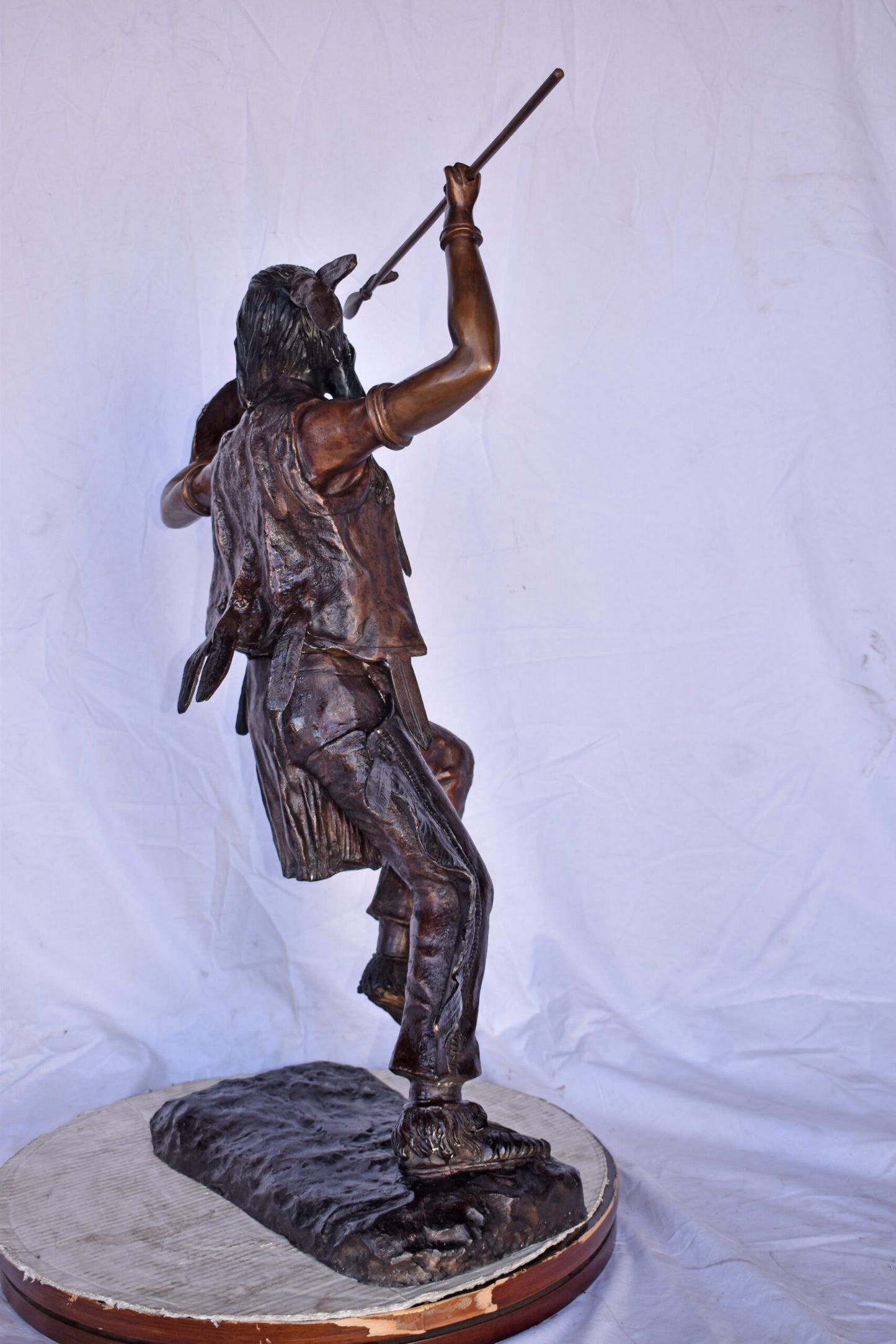 Indian Worrier Throwing a Spear Bronze Statue - Size: 15"L x 23"W x 38"H.
