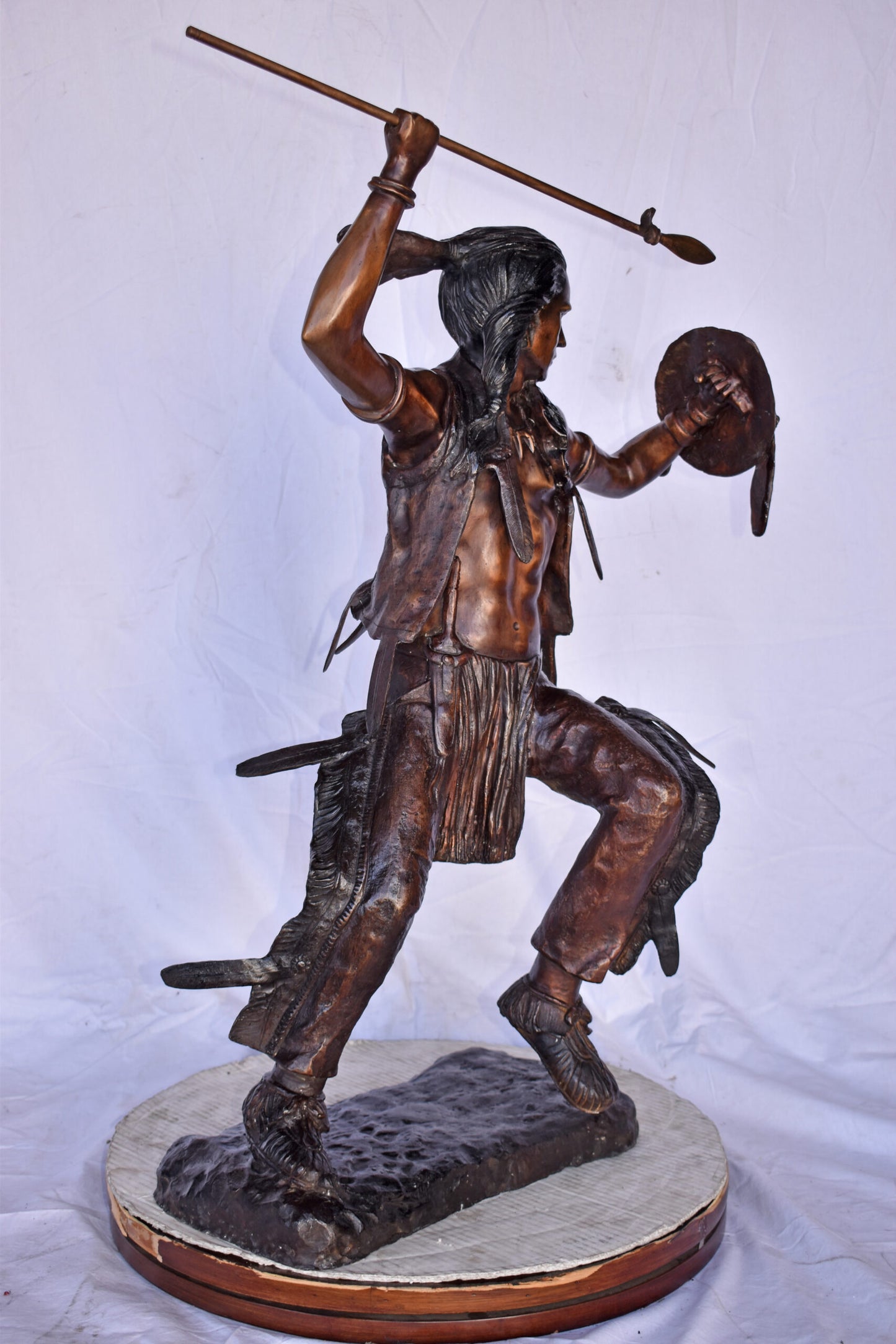 Indian Worrier Throwing a Spear Bronze Statue - Size: 15"L x 23"W x 38"H.