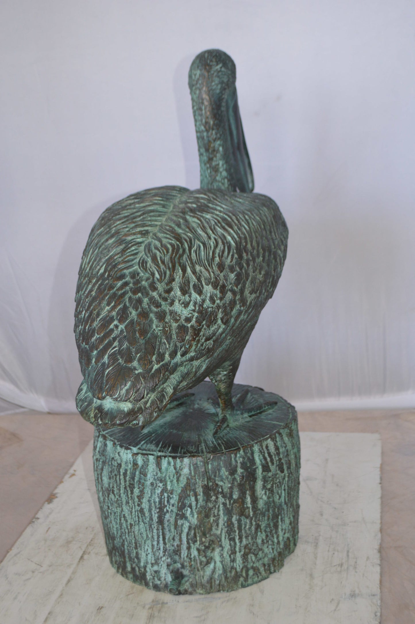 Pelican on a Tree Stump fountain bronze statue - Size: 30"L x 16"W x 46"H.
