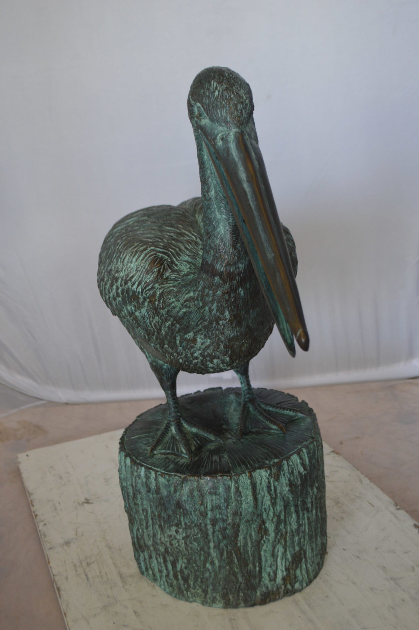 Pelican on a Tree Stump fountain bronze statue - Size: 30"L x 16"W x 46"H.