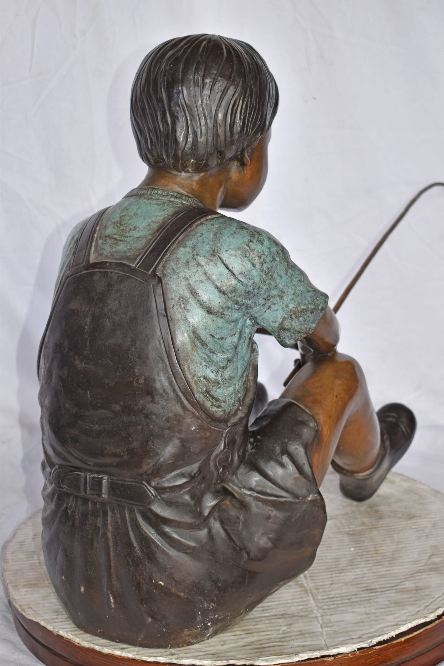 Boy Sitting on the Ground, Fishing Bronze Statue - Size: 26"L x 15"W x 25"H.