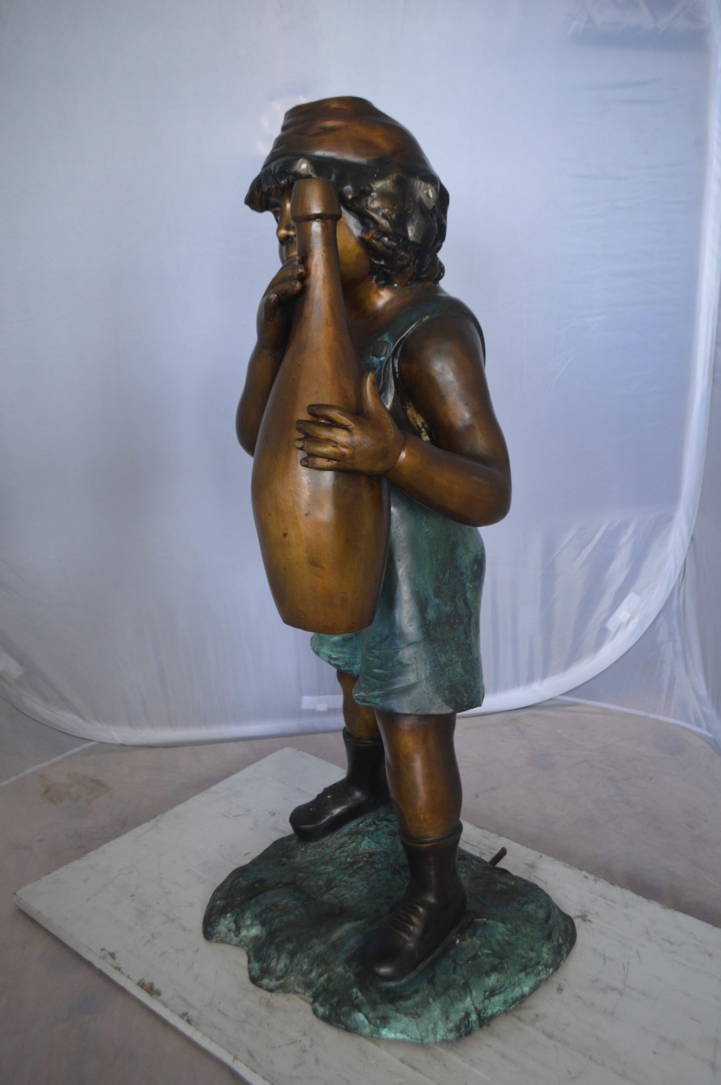 Boy holding a bottle water fountain - Size: 17"L x 14"W x 38"H.