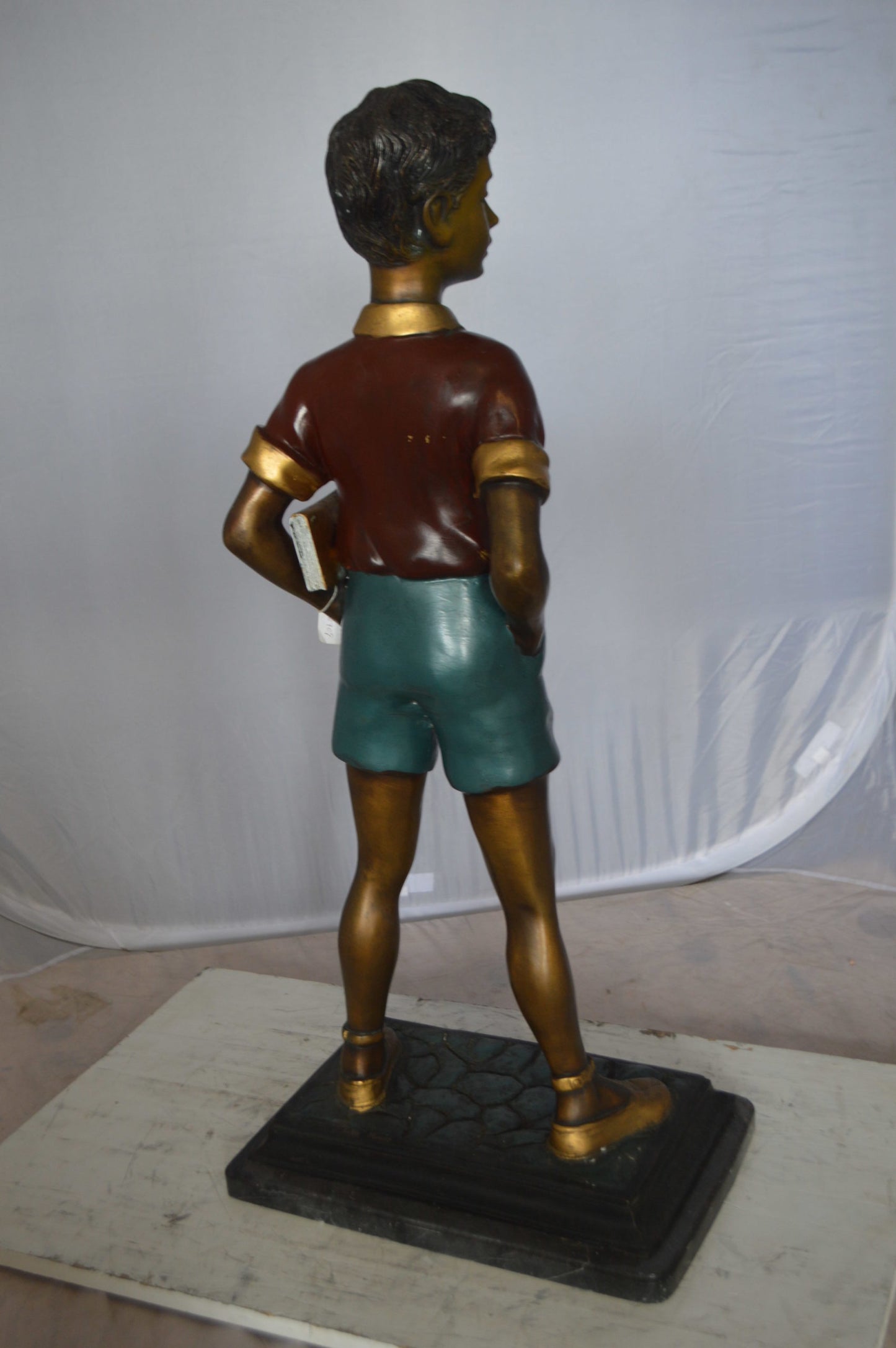 Kid Holding a Book Bronze Statue - Size: 18"L x 11"W x 36"H.
