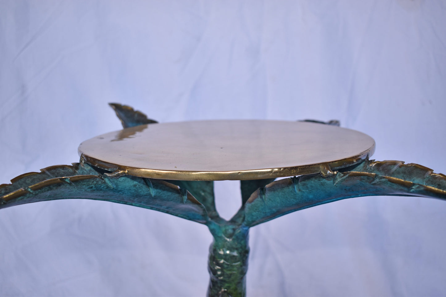 Camel Sitting Under A Palm Tree Bronze Statue - Size: 17"L x 27"W x 23"H.