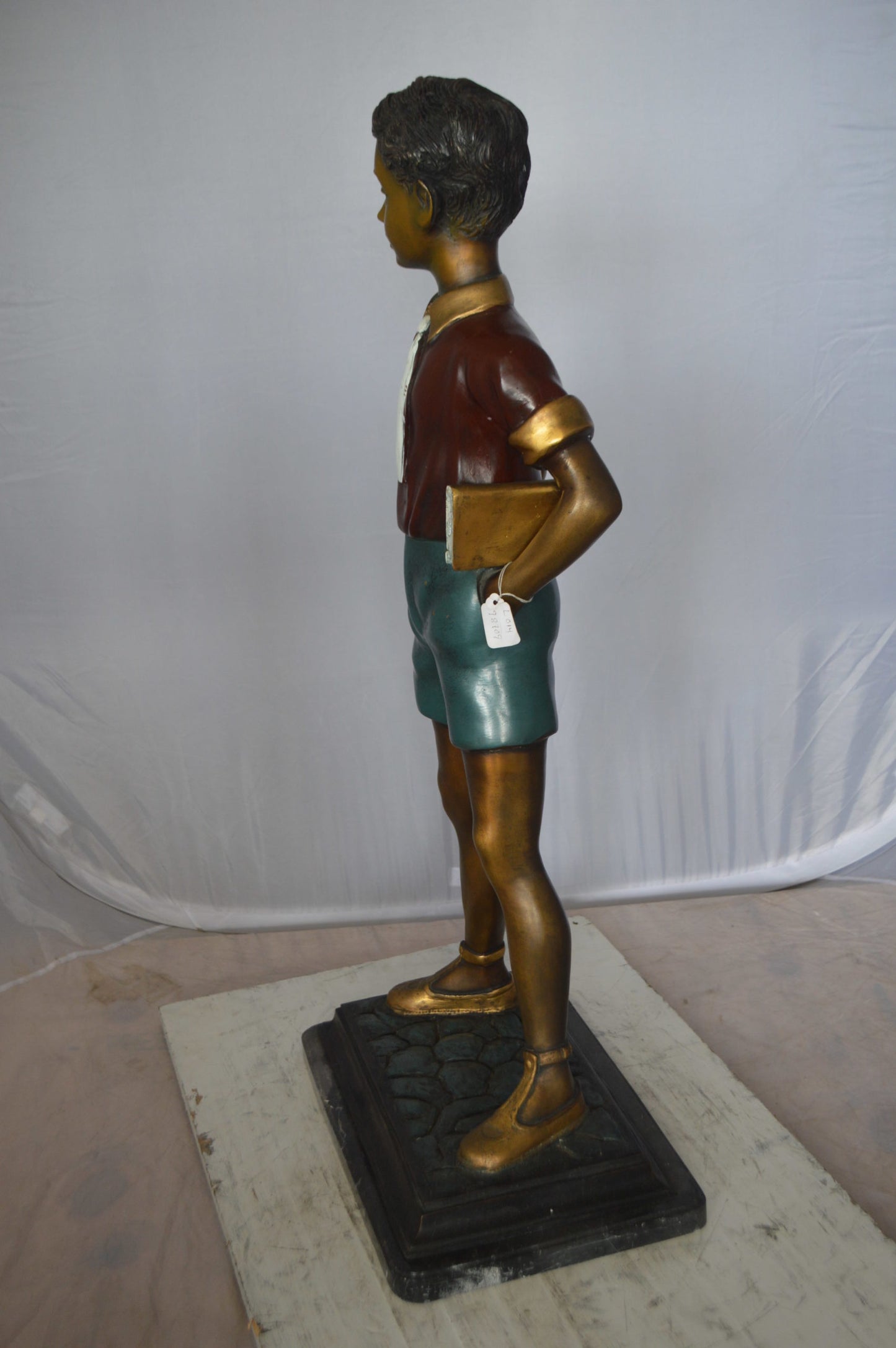 Kid Holding a Book Bronze Statue - Size: 18"L x 11"W x 36"H.