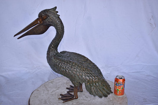 Pelican Standing and Looking Ahead Bronze Statue - Size: 27"L x 8"W x 22"H.