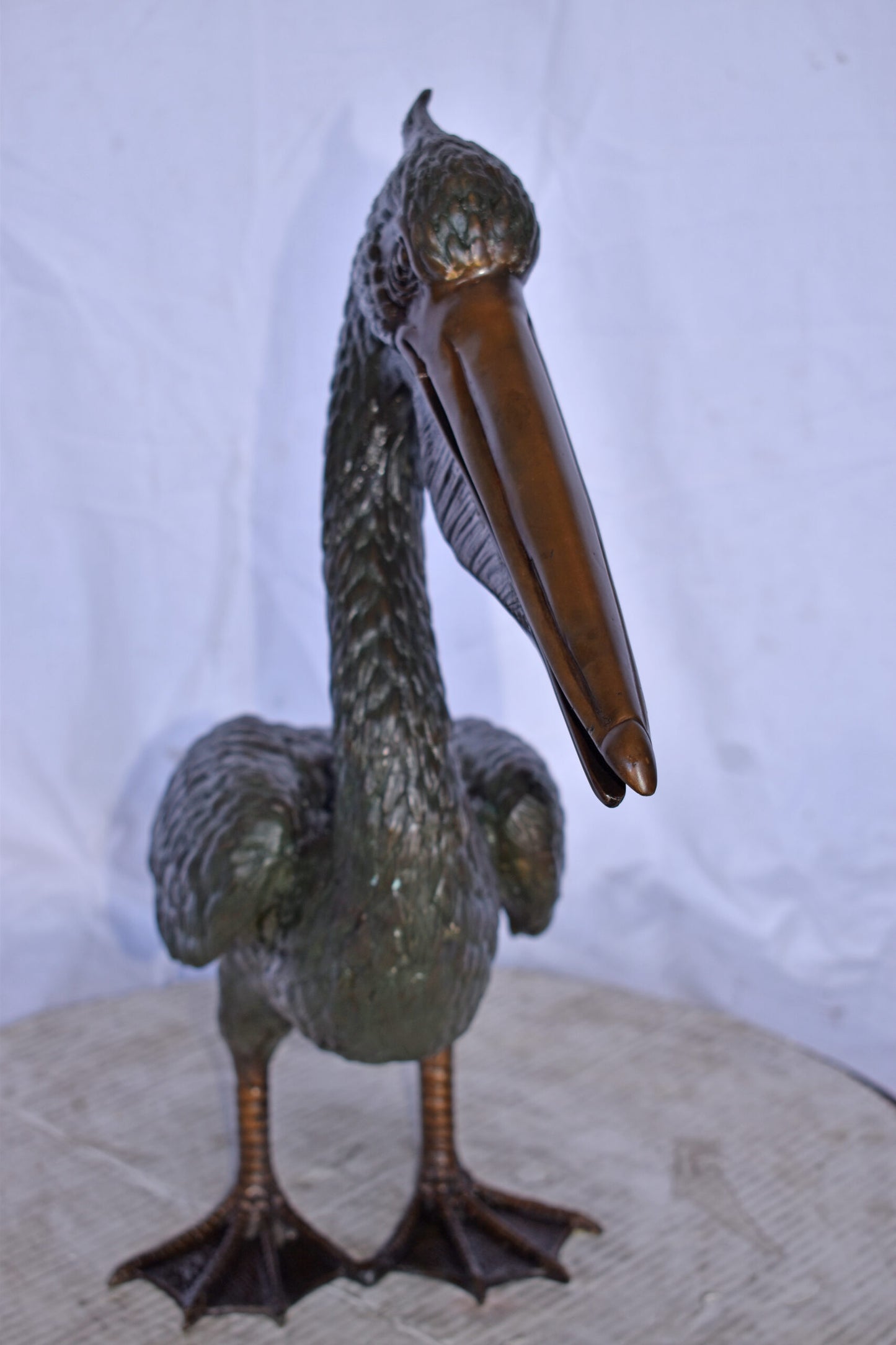 Pelican Standing and Looking Ahead Bronze Statue - Size: 27"L x 8"W x 22"H.