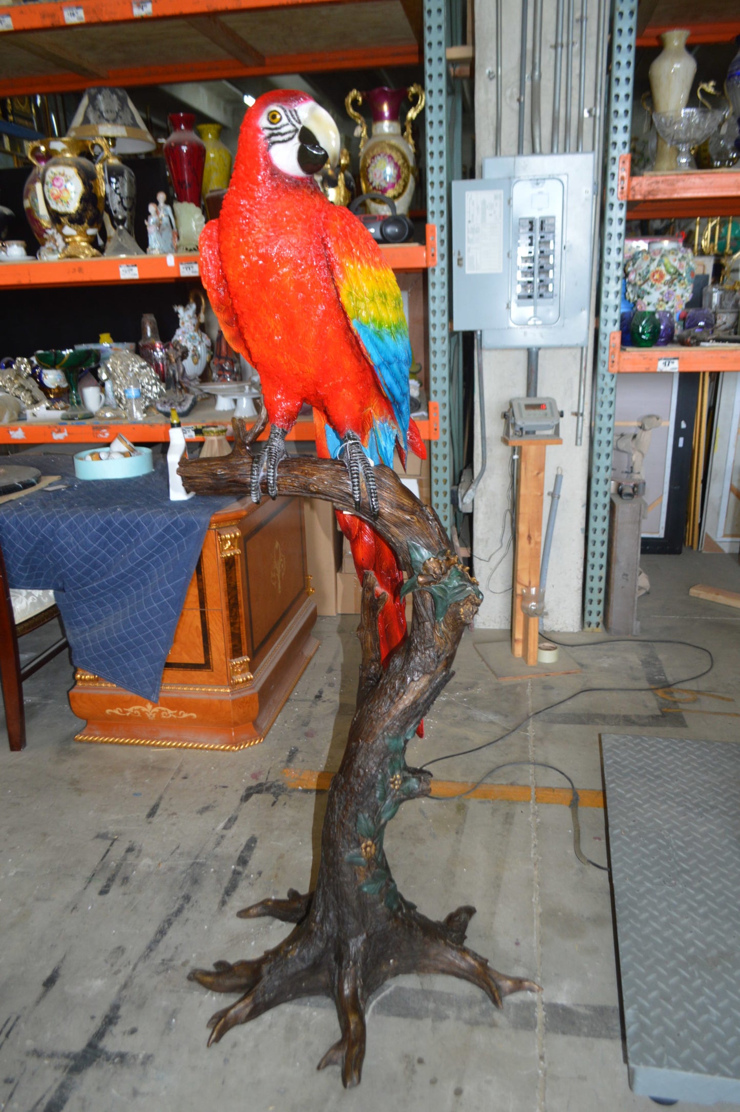 Single Red and Blue Parrot on a tree Bronze Statue - Size: 30"L x 24"W x 66"H.