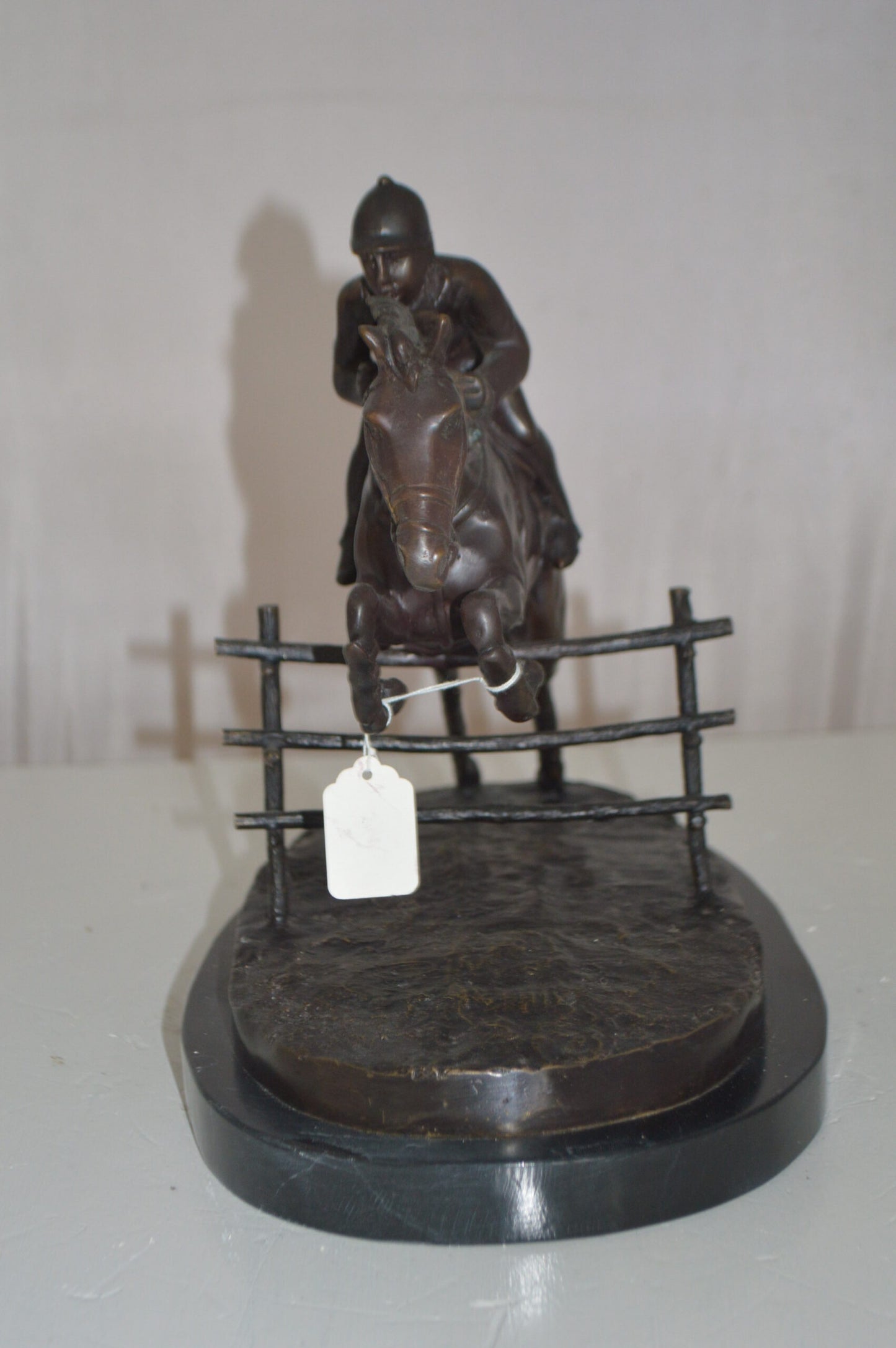 Jockey With Horse Jumping Over Hurdle Bronze Statue - Size: 14"L x 9"W x 13"H.