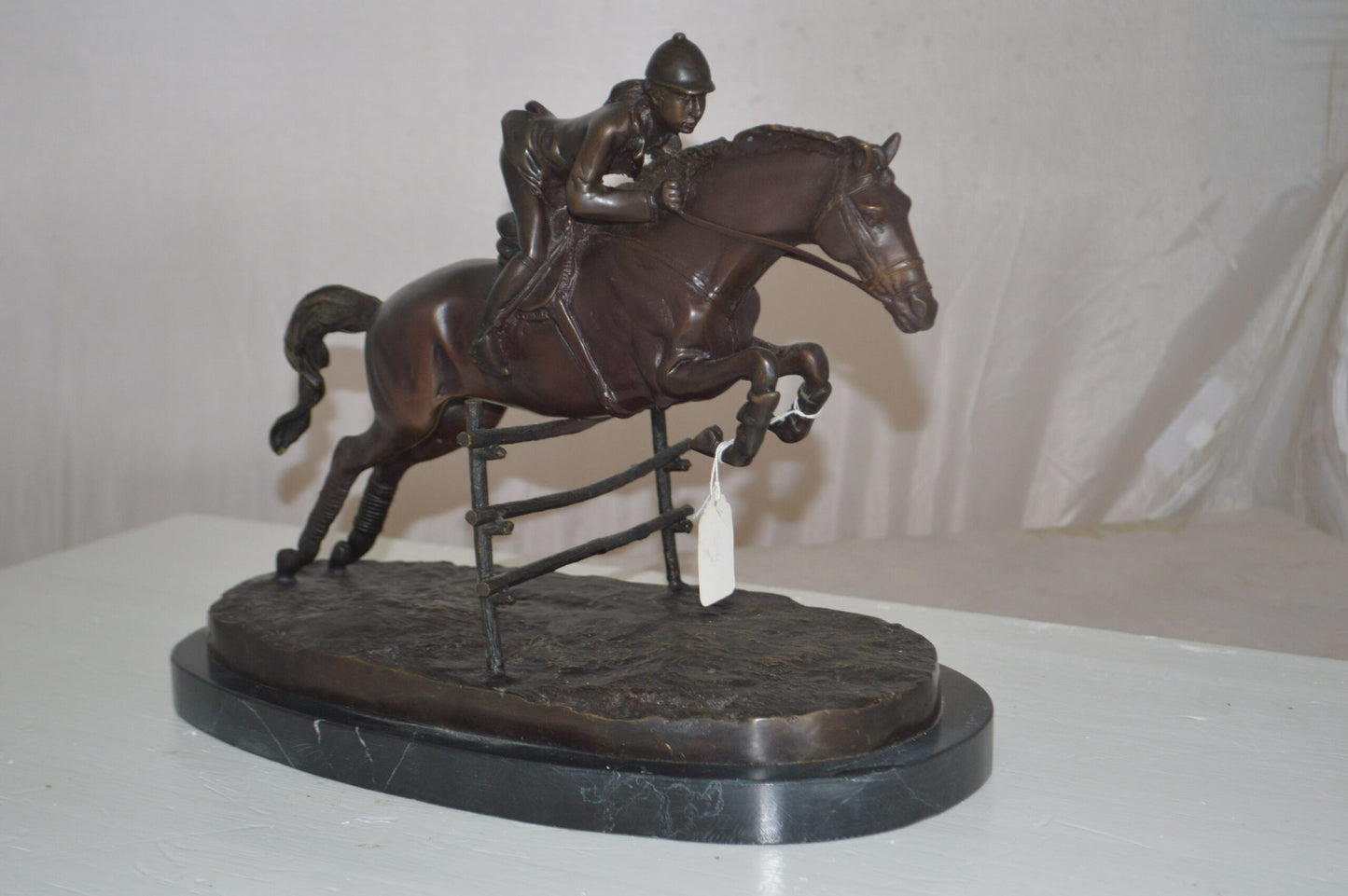 Jockey With Horse Jumping Over Hurdle Bronze Statue - Size: 14"L x 9"W x 13"H.
